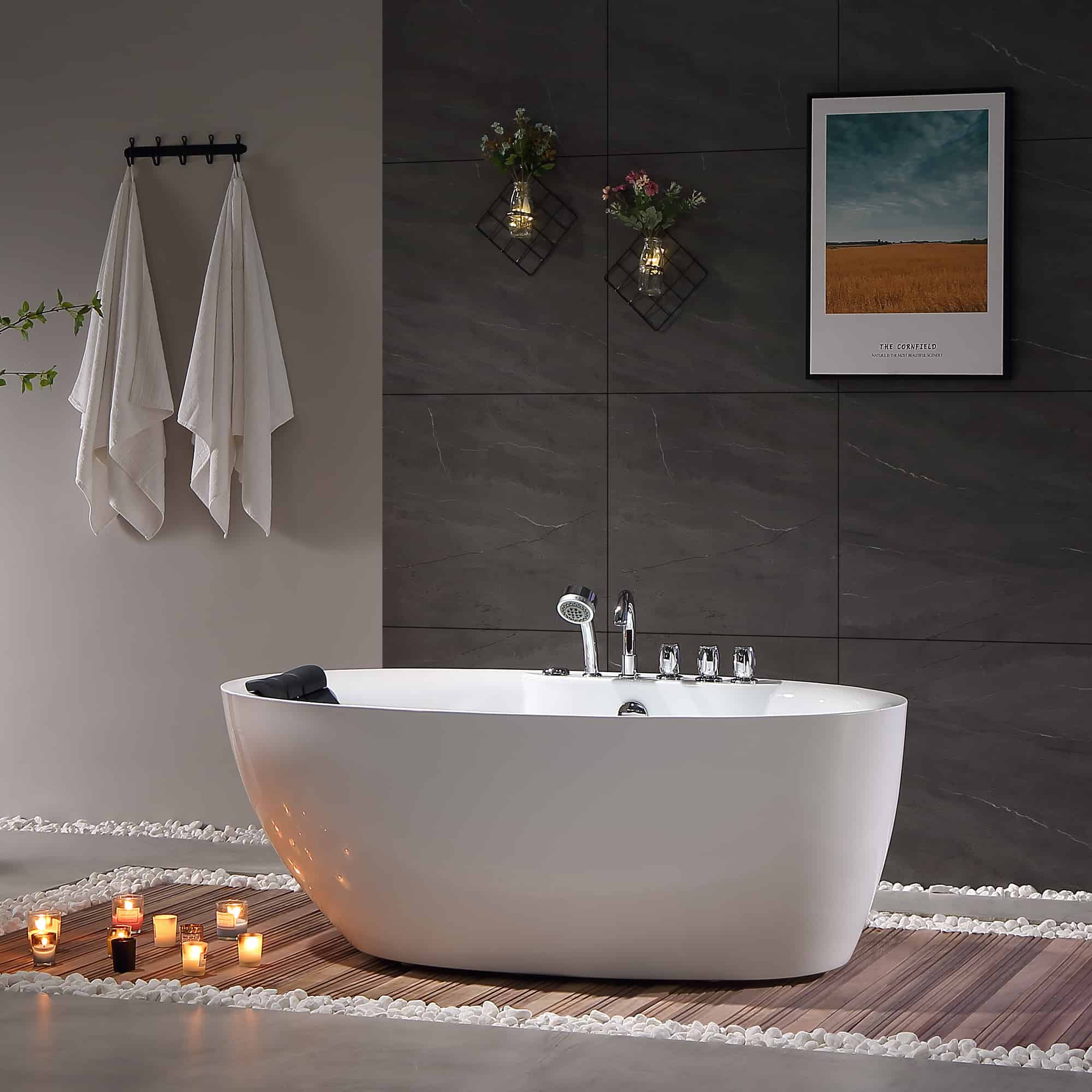 White freestanding acrylic whirlpool bathtub with chrome faucet and contoured front