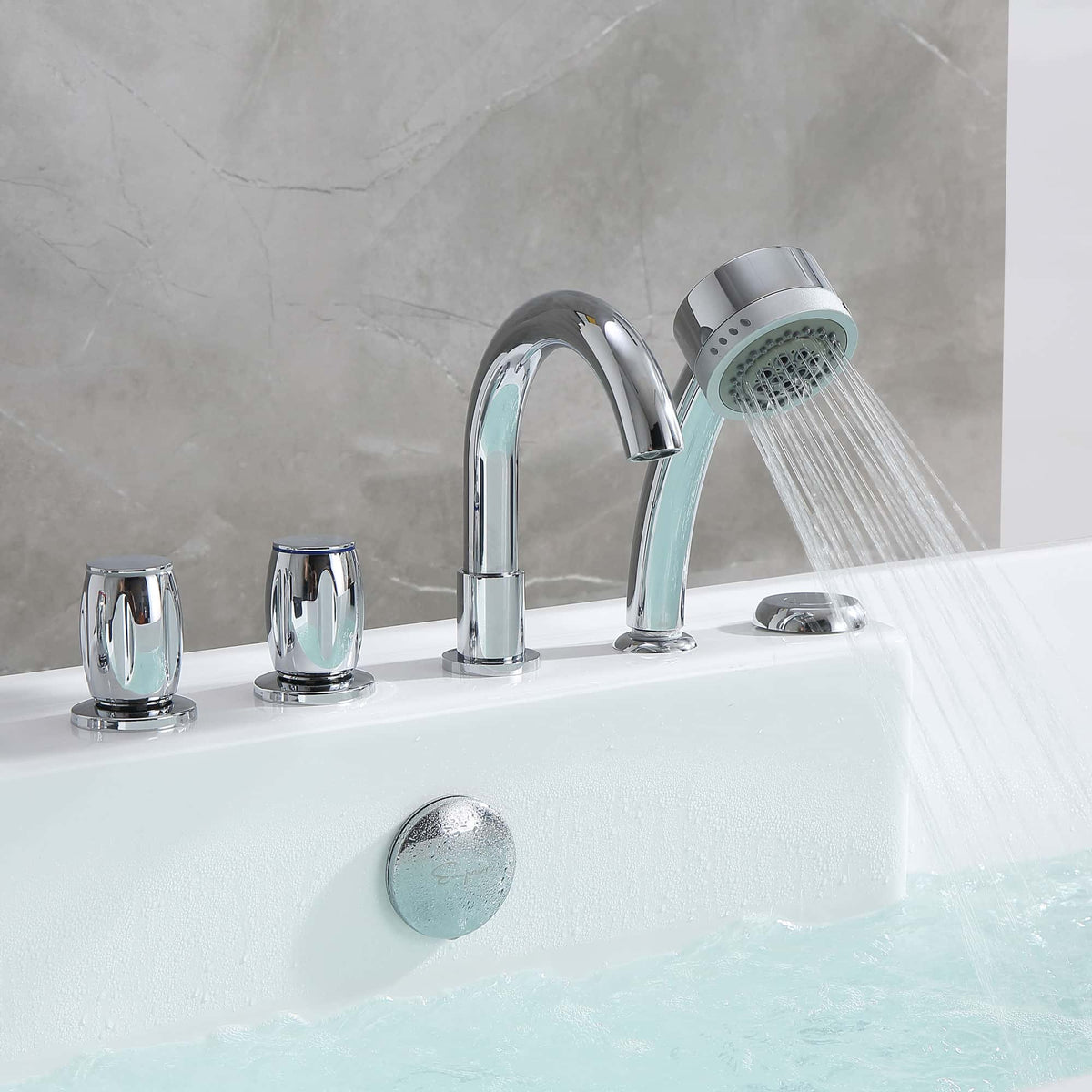 Close-up of chrome bathtub faucet with hand shower over white acrylic tub and water