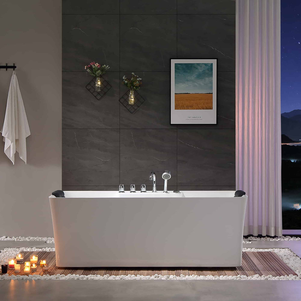 Freestanding white acrylic whirlpool bathtub with chrome faucet, black headrests, and tub rim