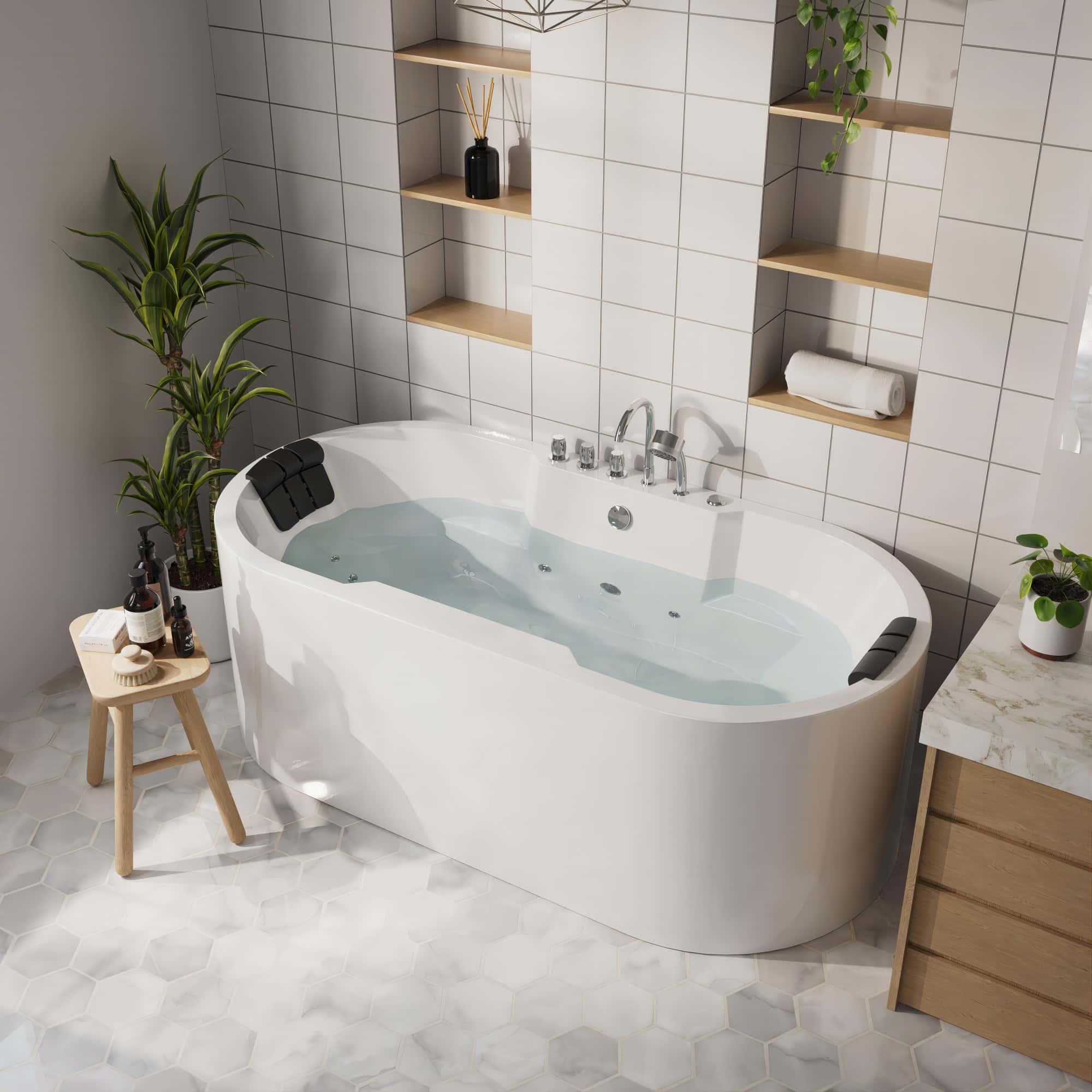 White freestanding oval whirlpool bathtub with built-in headrests and chrome controls