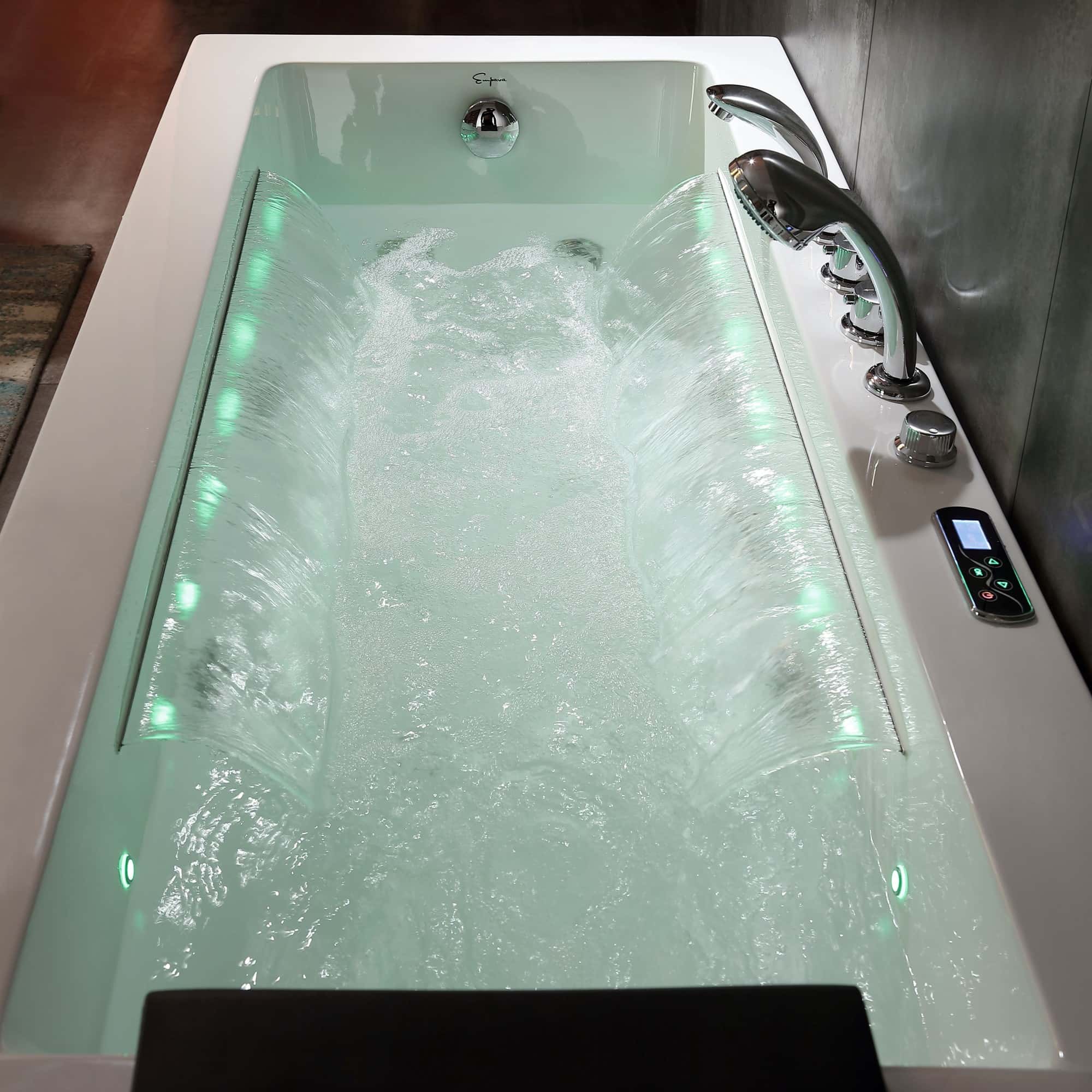 White rectangular whirlpool bathtub with chrome faucet and blue LED jet lights