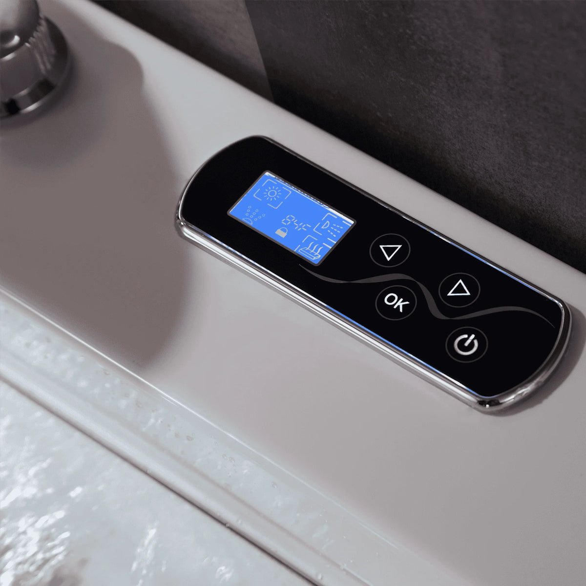 White whirlpool bathtub control panel with blue display and touch buttons