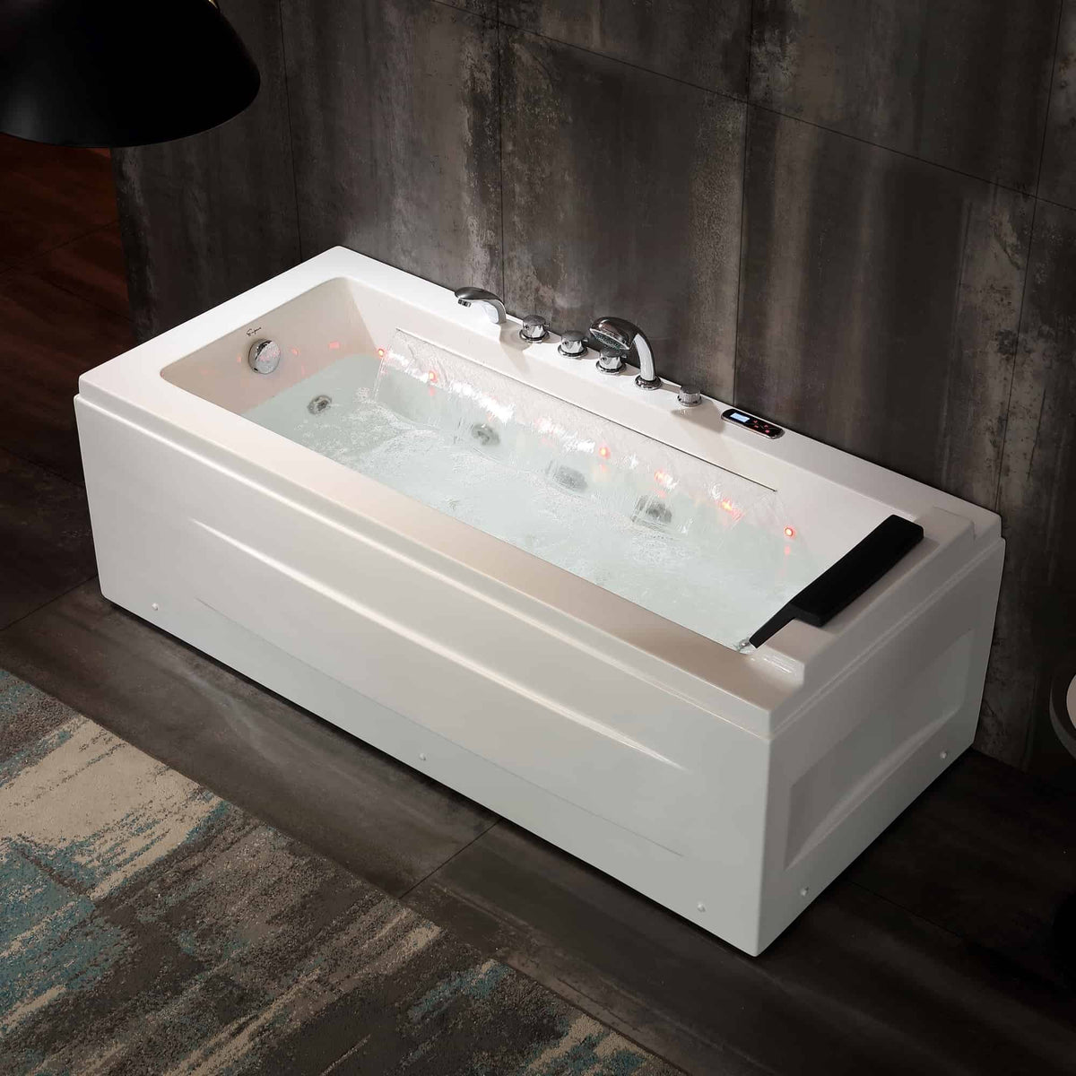 White rectangular whirlpool bathtub with chrome faucet set and LED-lit jets