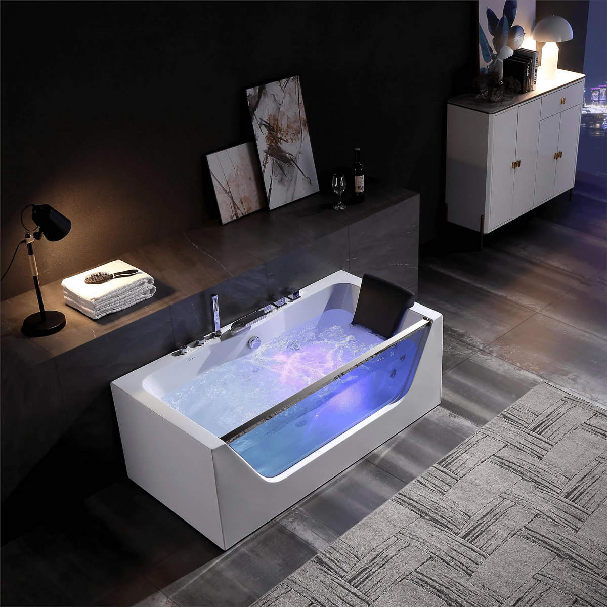 White whirlpool bathtub with dark headrest and LED blue interior lighting