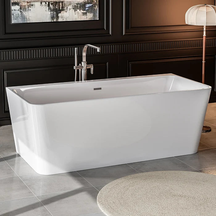 Freestanding soaking tub with center drain, glossy white tub and tall chrome faucet.