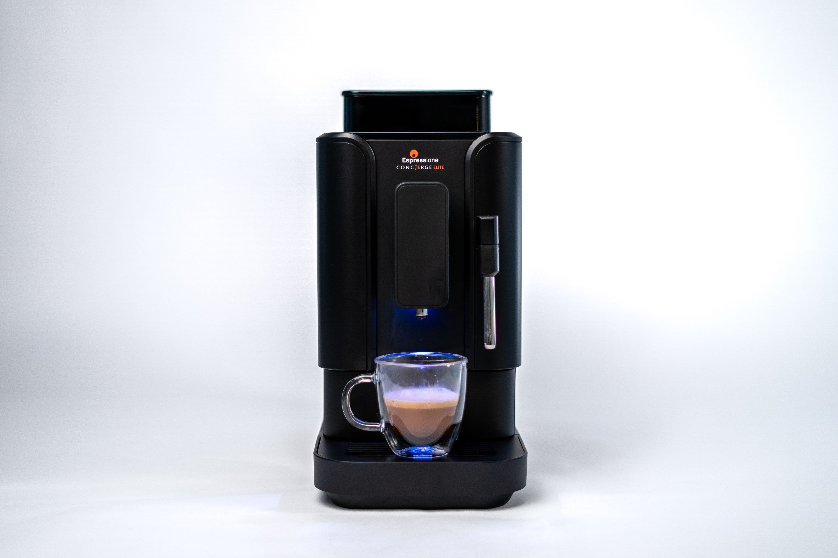 Front view of black bean-to-cup espresso machine with cup under spout