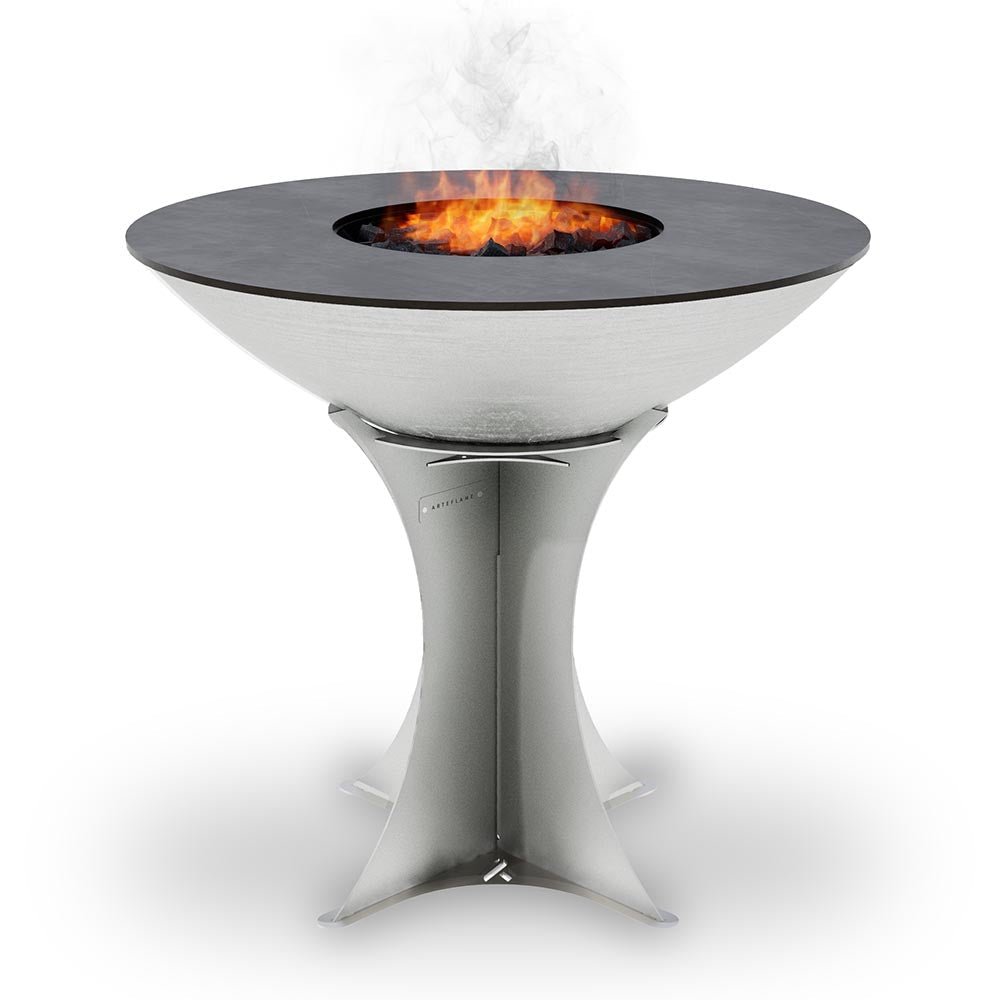 Round stainless steel fire pit grill with circular opening and flames inside, pedestal stand