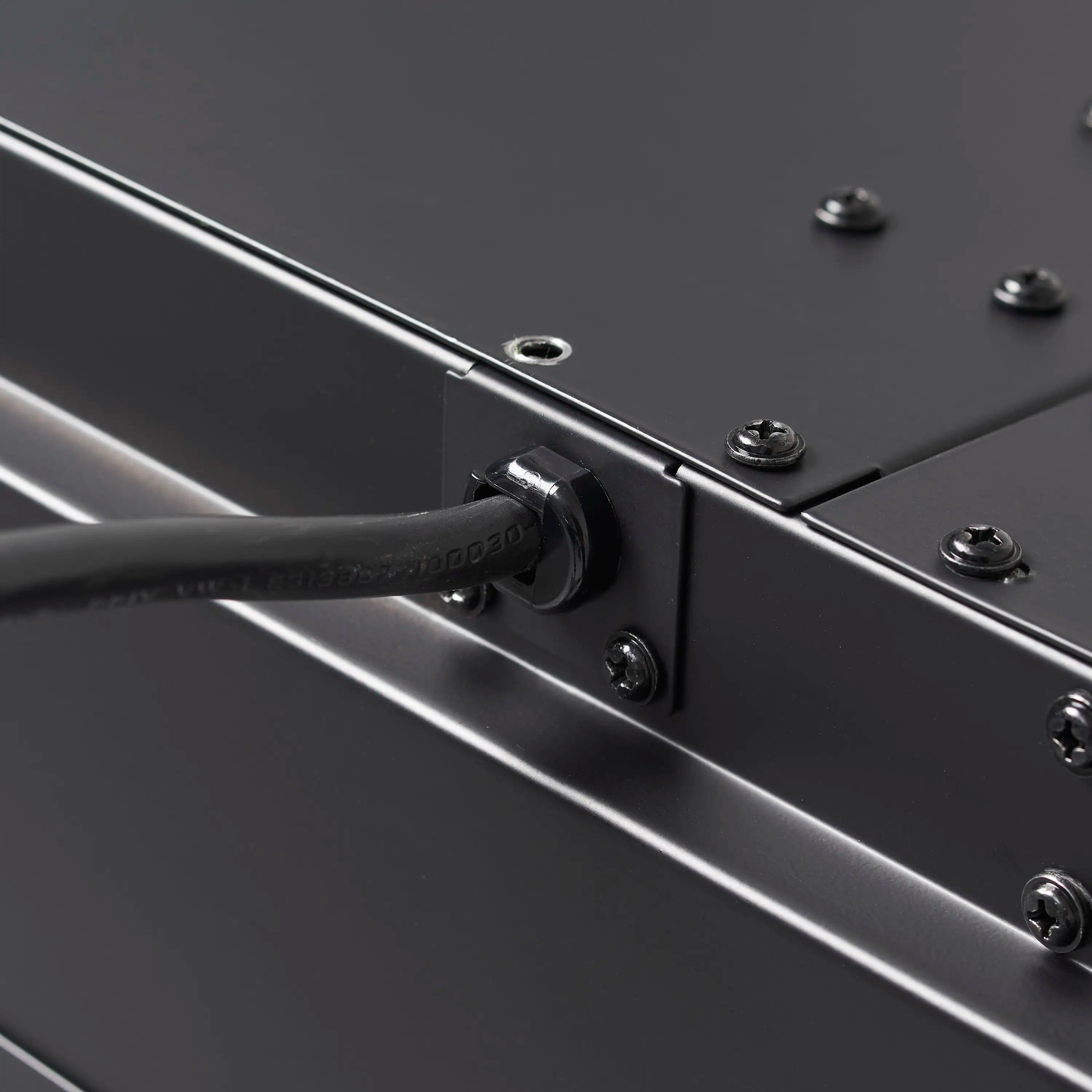 Linear electric fireplace control panel detail with brushed metal trim and screws