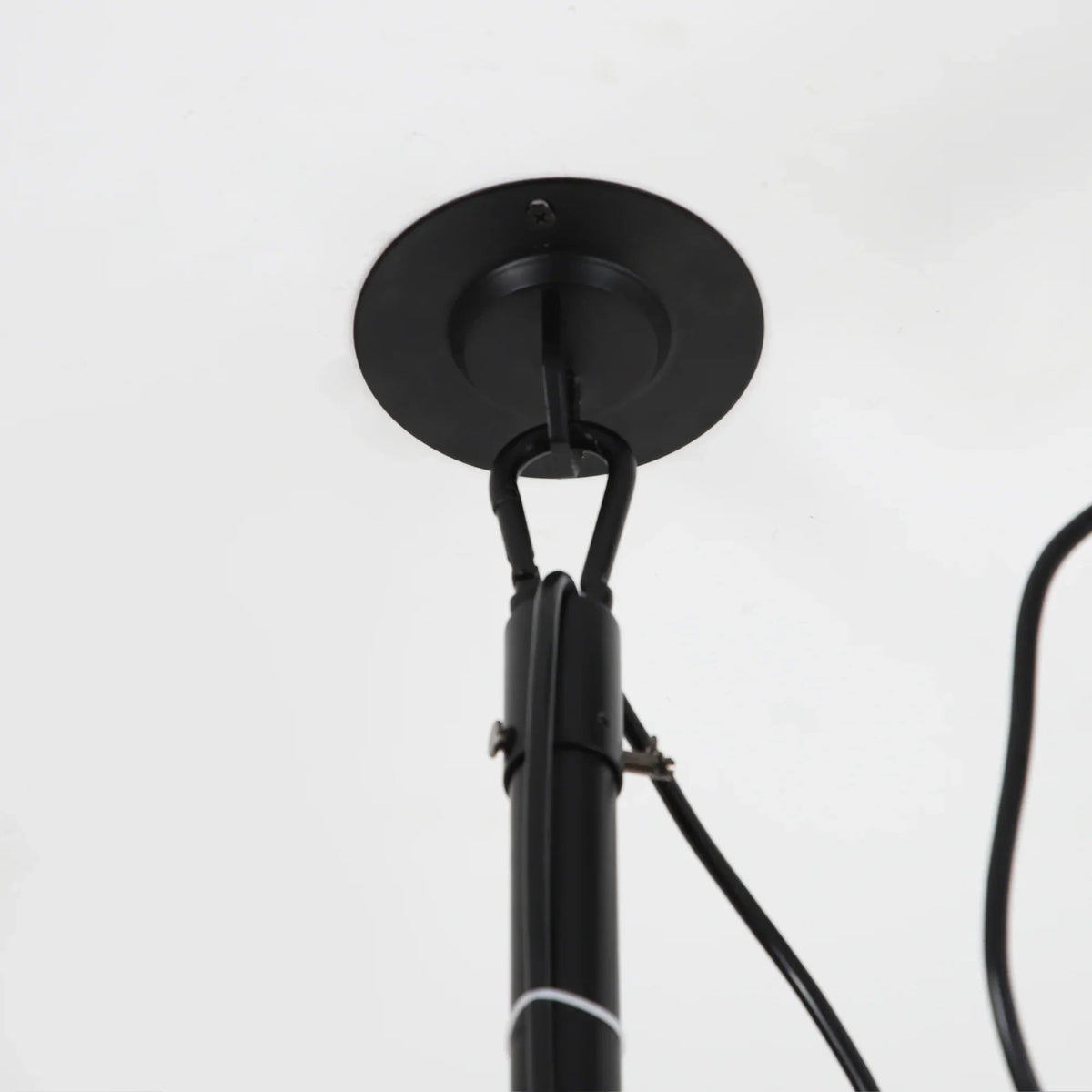 Black ceiling fan downrod and mounting bracket with attached power cord