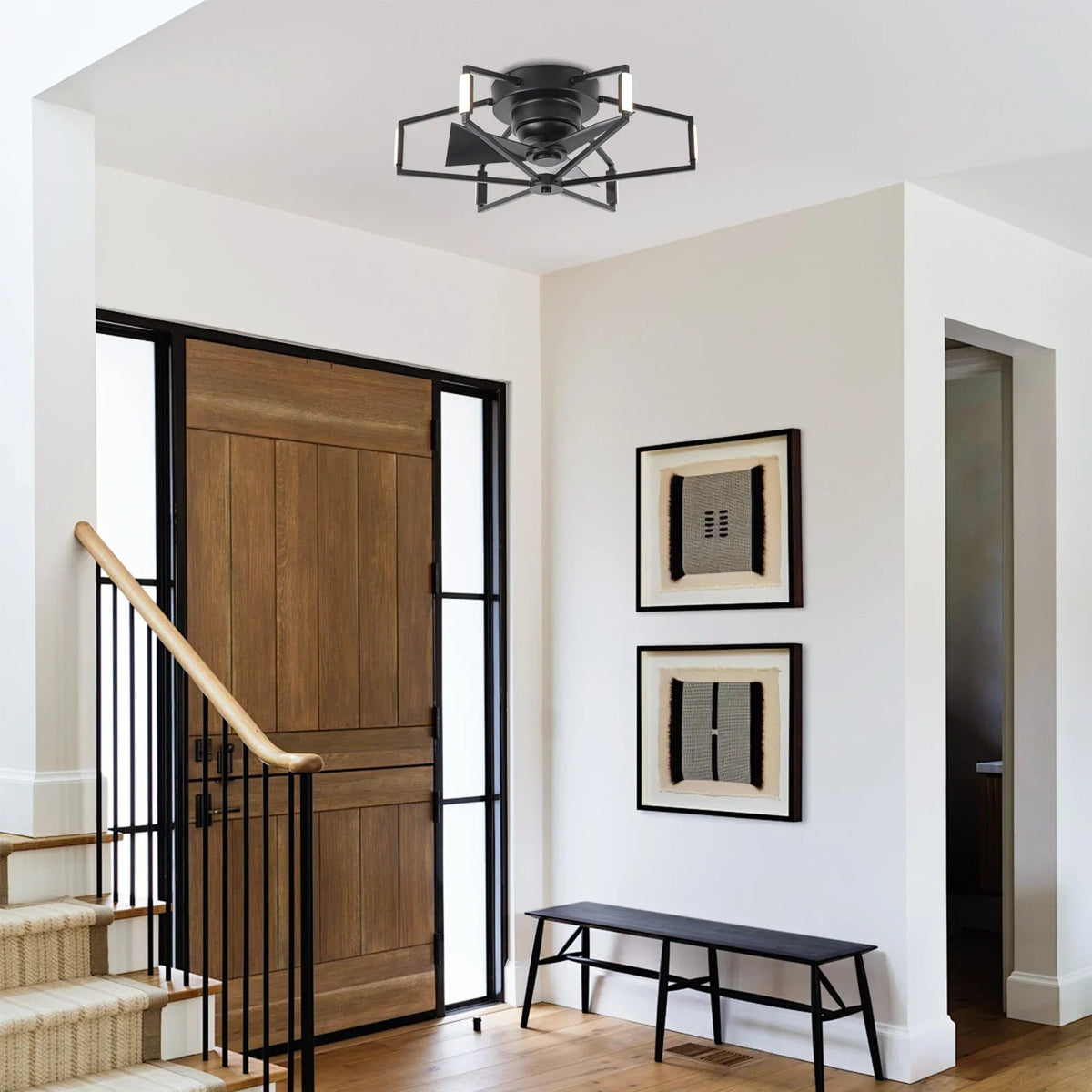 Black flush-mount LED ceiling fan with metal light arms and dark blades