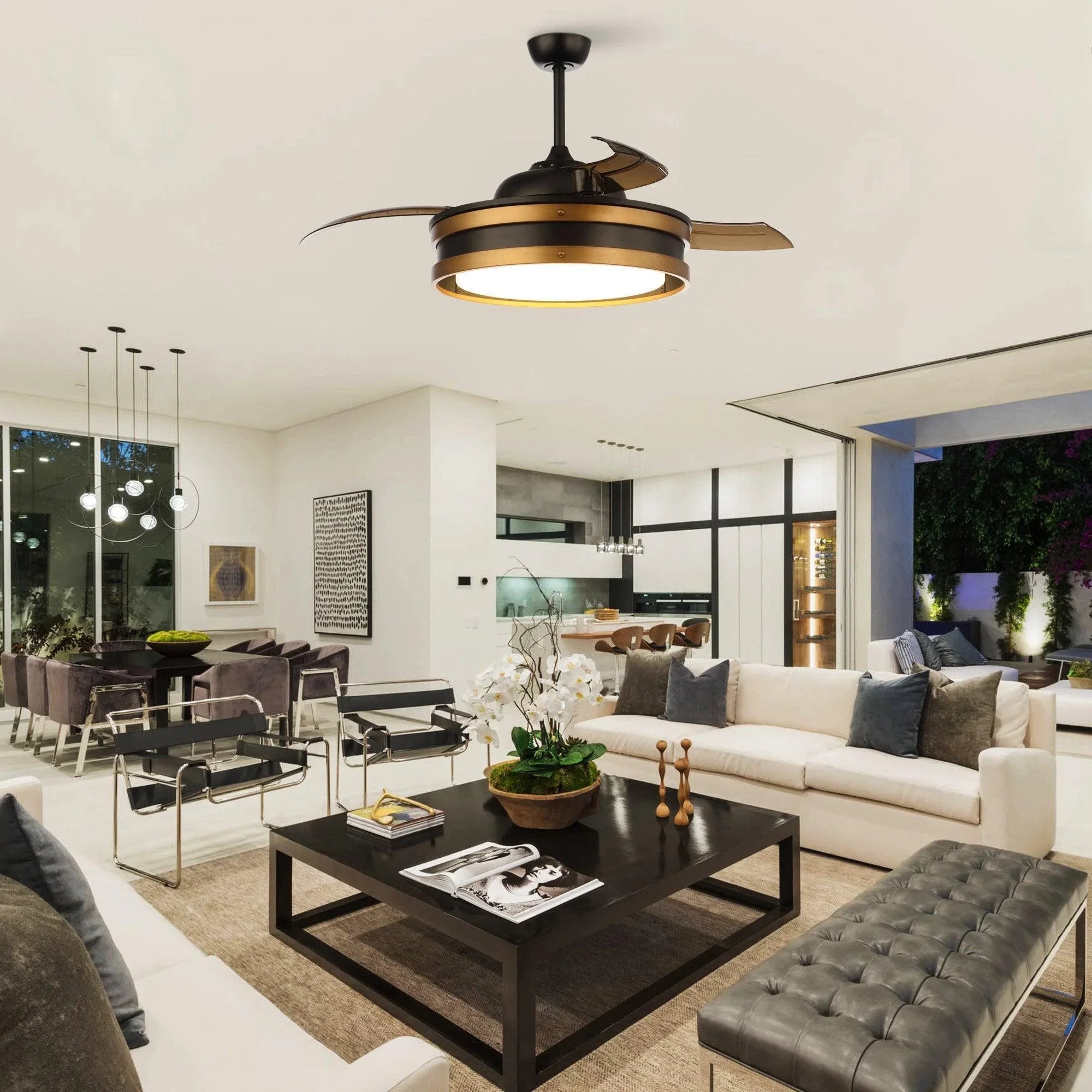 Black 52-inch smart ceiling fan with LED light and bronze blades in outdoor seating area.