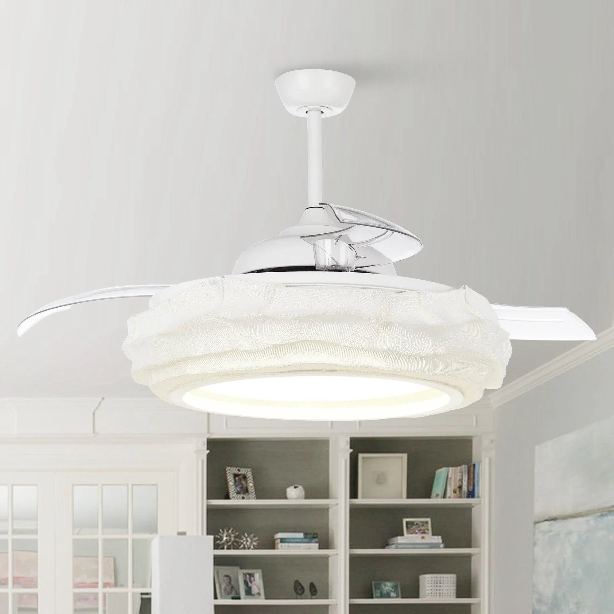 White ceiling fan with LED light, angled view showing clear housing and fabric-look blades