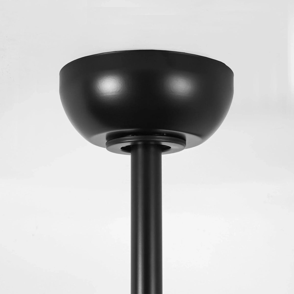 Black ceiling fan motor housing with downrod connection