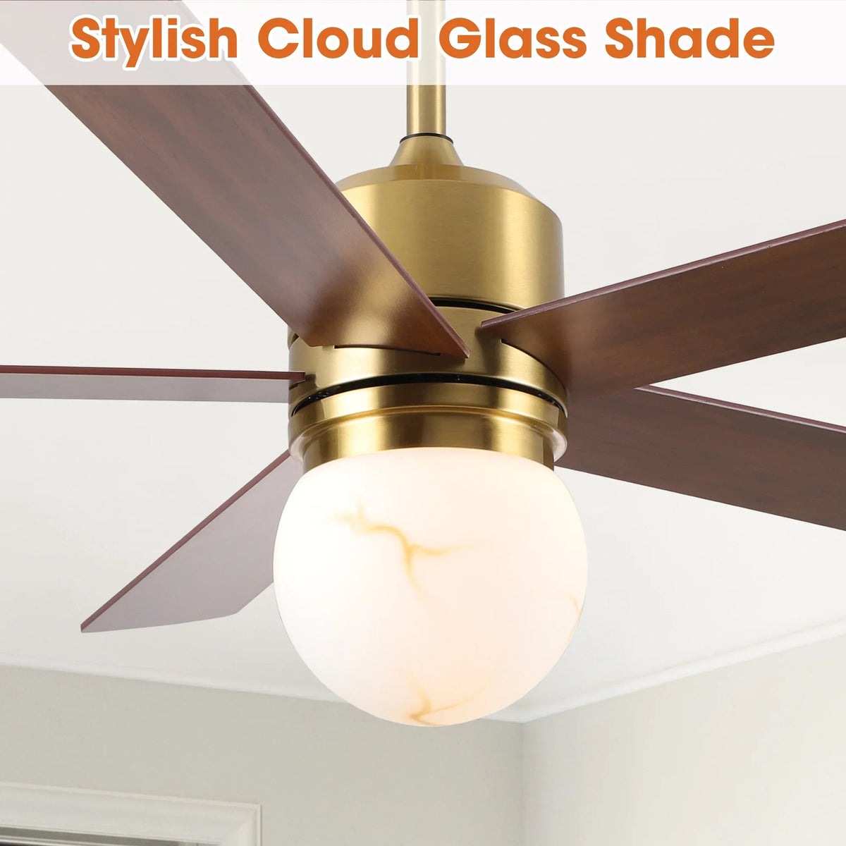 Golden ceiling fan with dark brown blades and frosted globe LED light front view