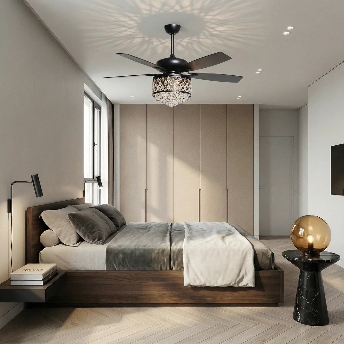 Black ceiling fan with crystal light kit above bed in modern room