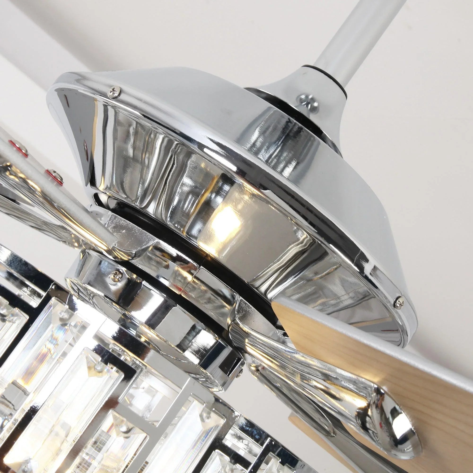 Chrome ceiling fan motor housing with crystal light glass, reflective finish