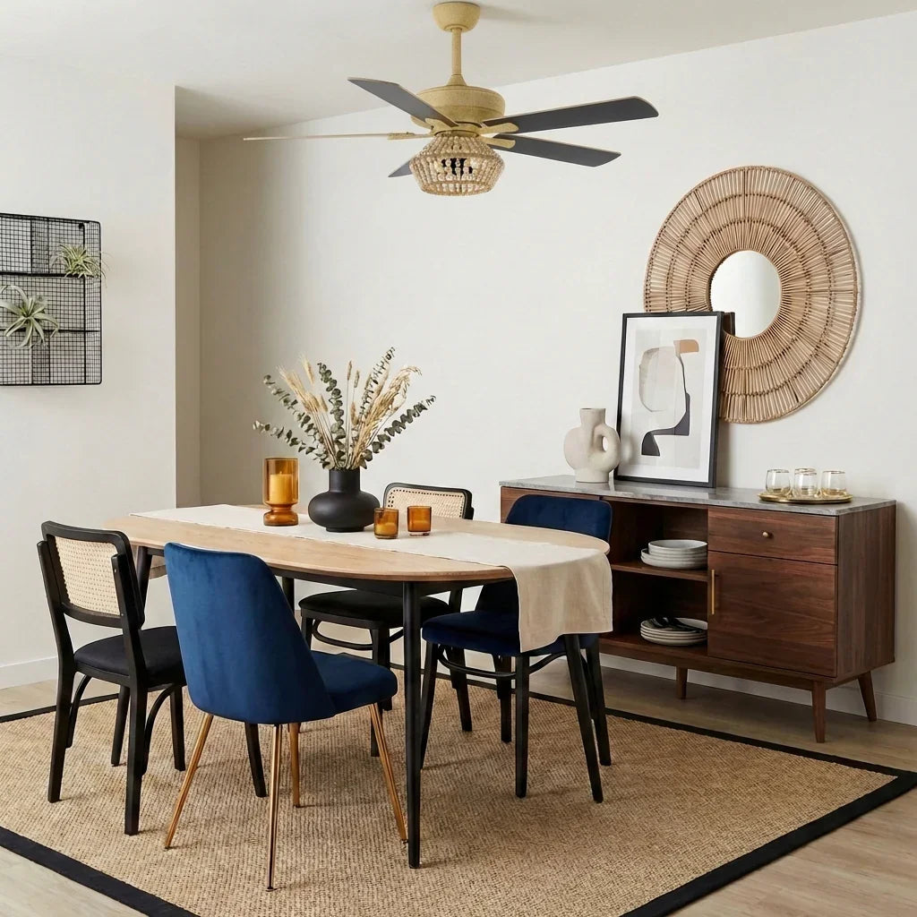Golden ceiling fan with beaded light globe above dining table