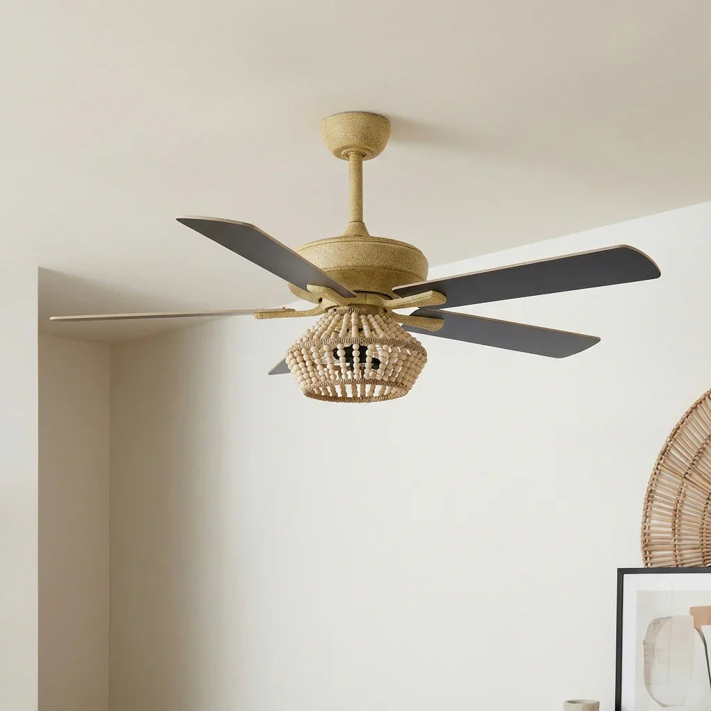 Golden farmhouse ceiling fan with beaded light globe and five wood blades