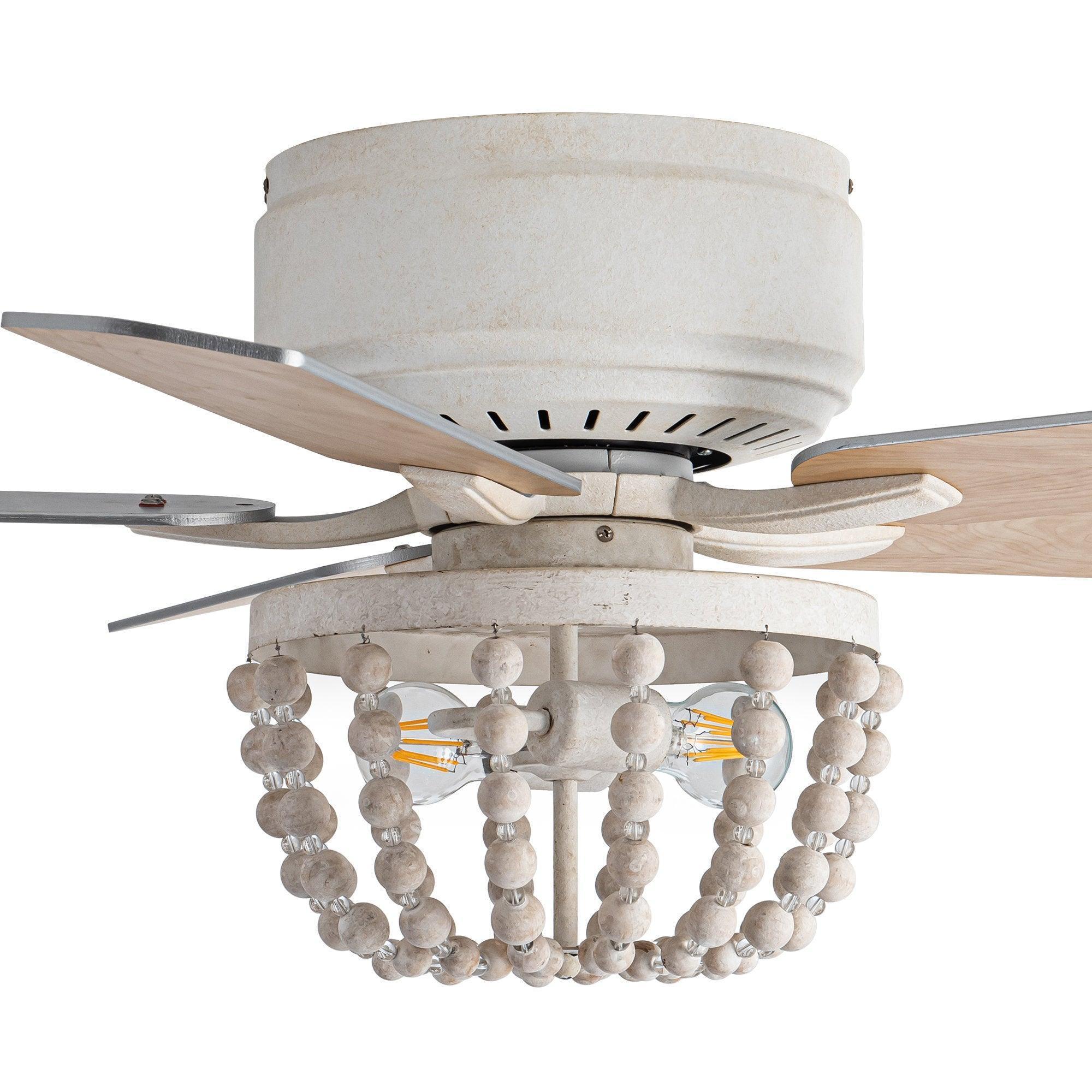 Flush mount ceiling fan with white housing, wood blades, and hanging bead light shade