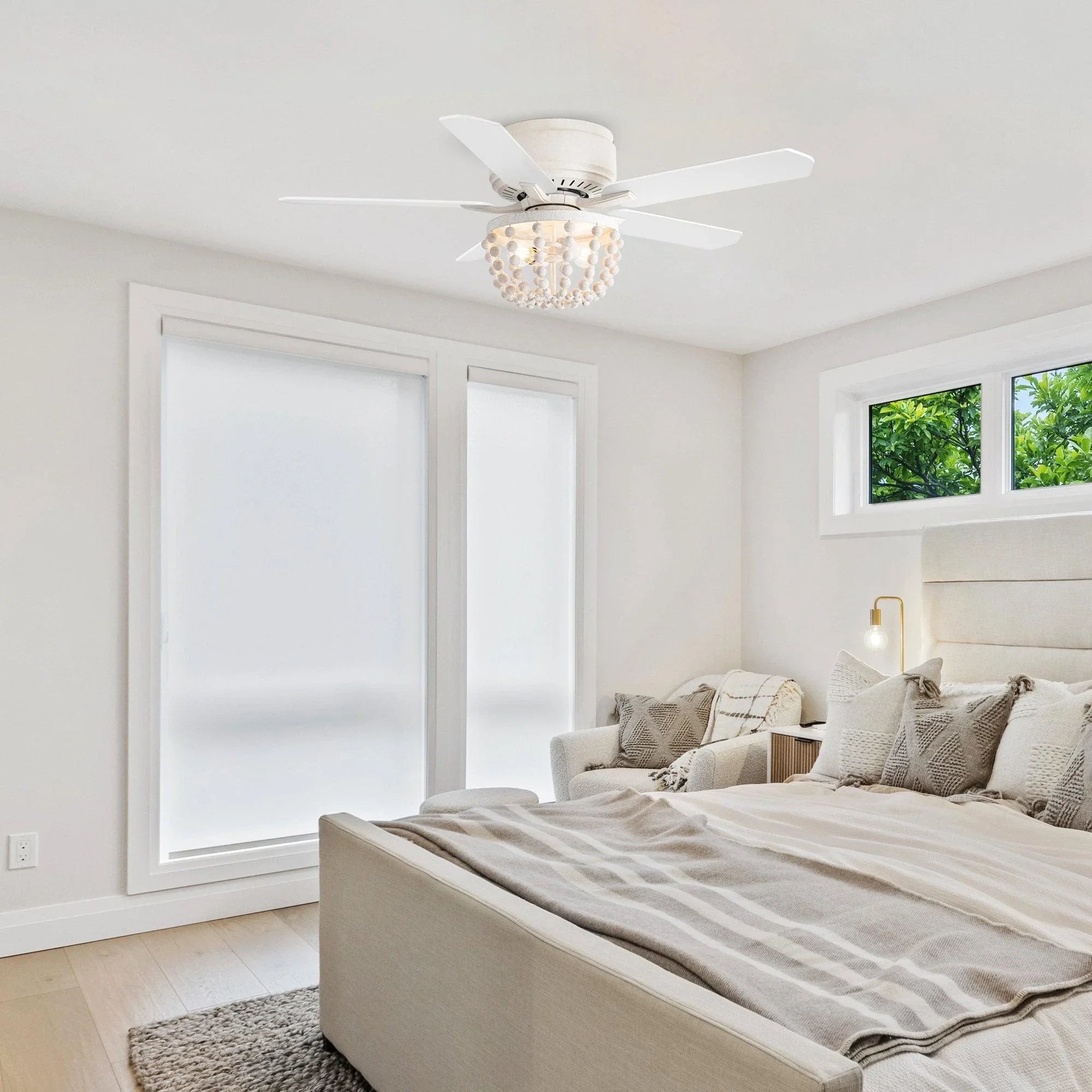 Flush mount ceiling fan with white housing, wood blades, and crystal bead light