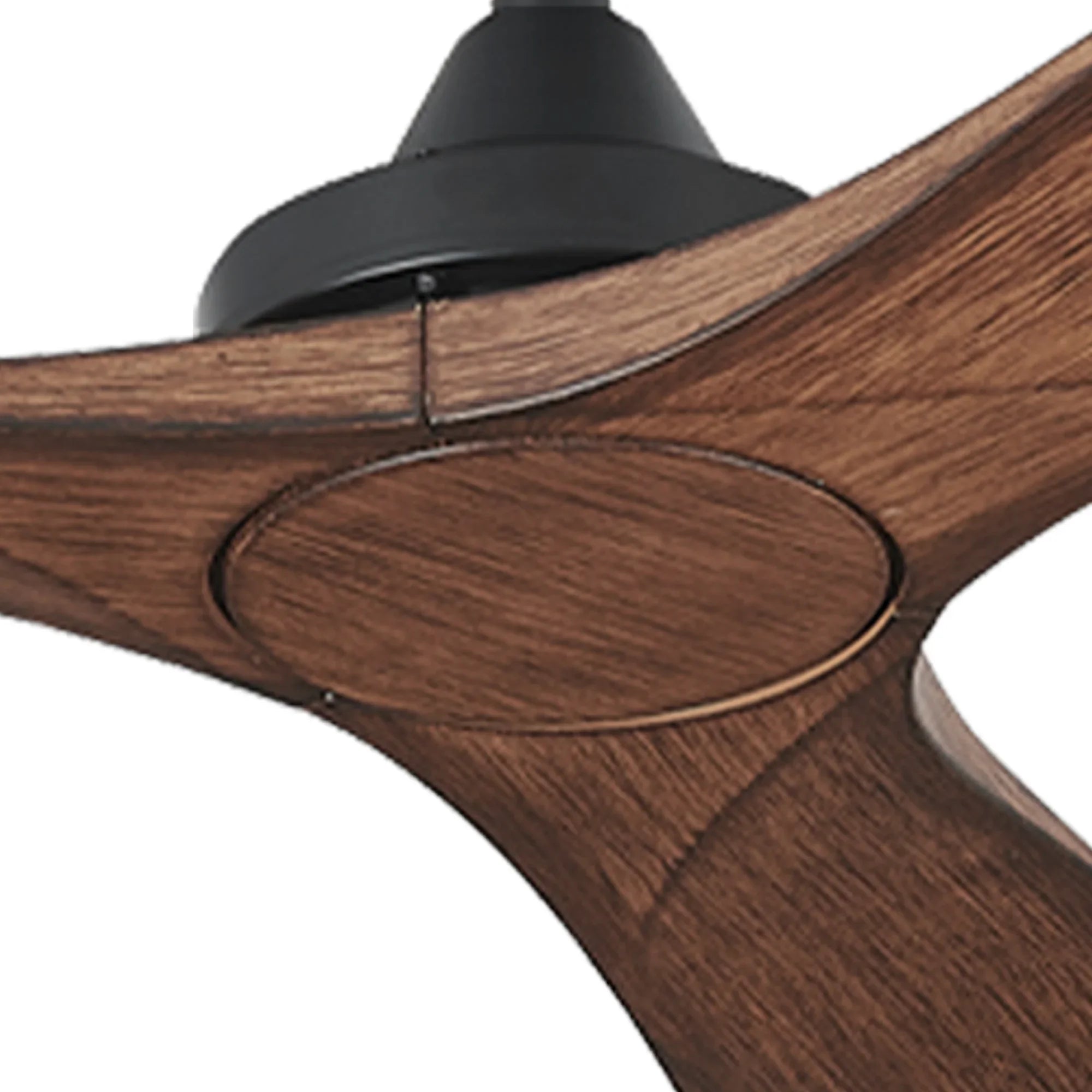 Close-up of brown ceiling fan blade hub with circular cover and black motor top
