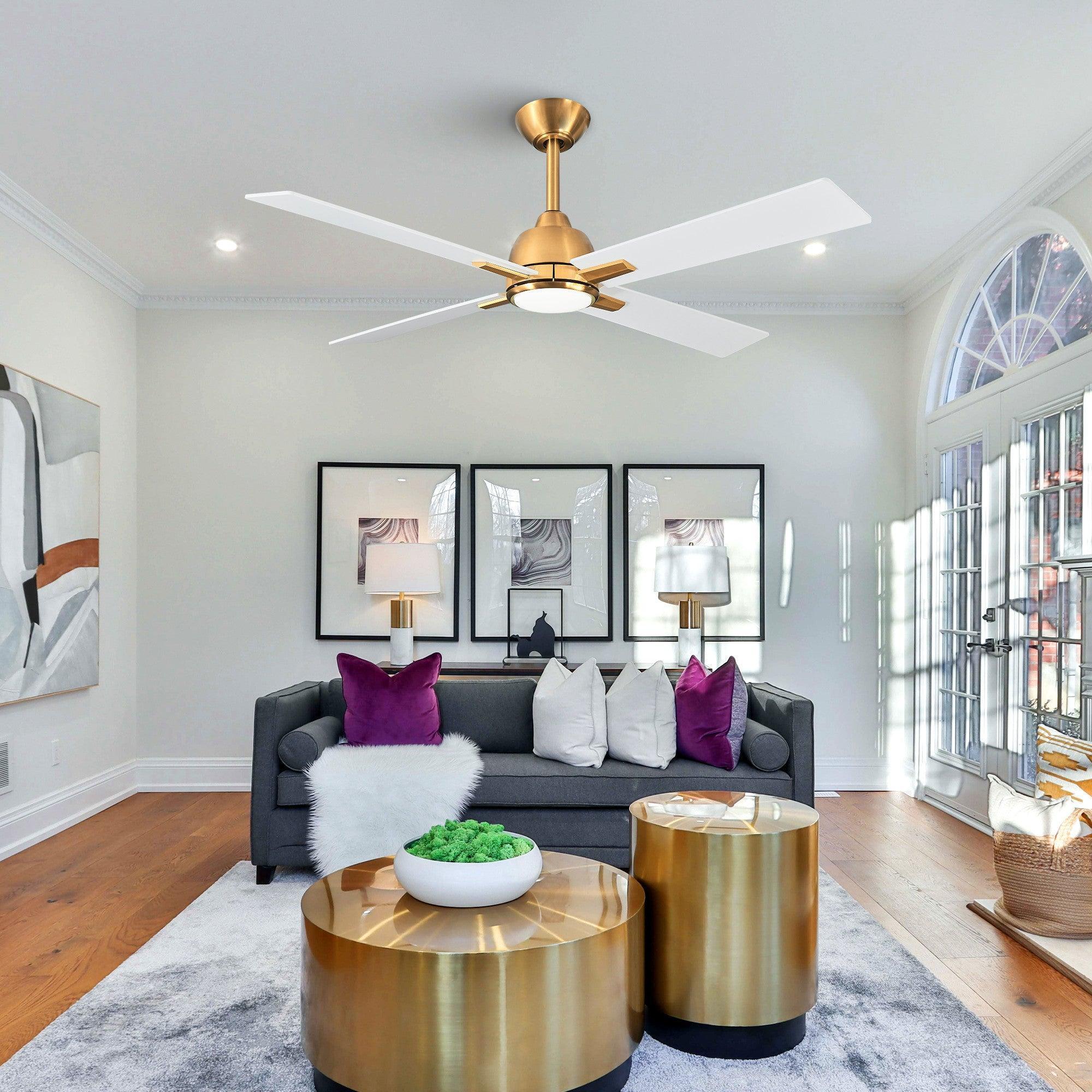Golden ceiling fan overhead with white blades and light over a seating area