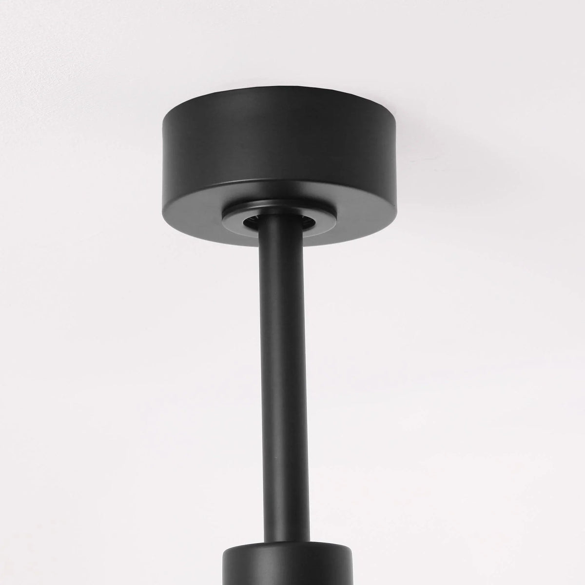 Downrod-mount ceiling fan motor housing in dark finish with short downrod