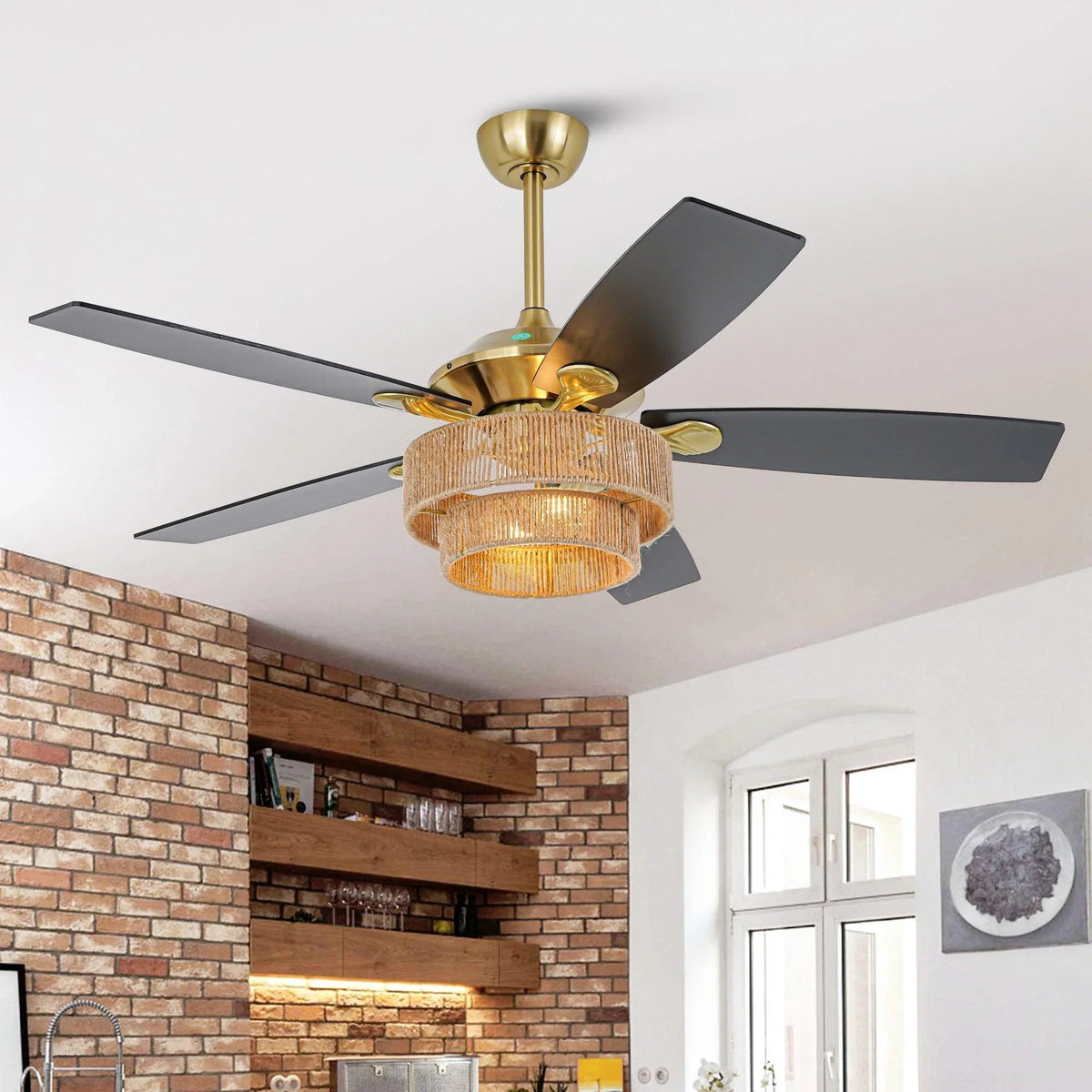 Golden ceiling fan with dark blades and wicker drum light shade