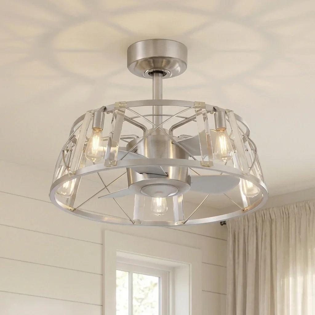 Satin nickel ceiling fan light with clear glass shade, black motor, and metal cage