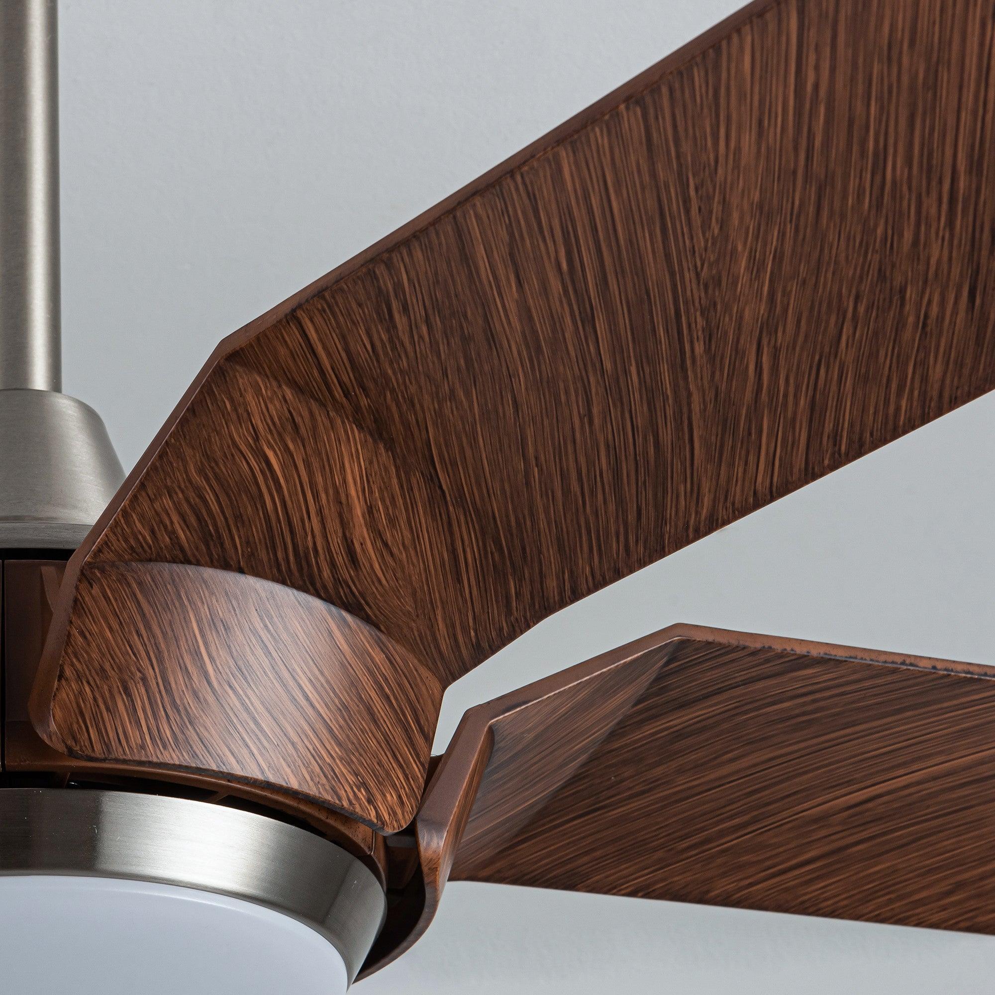 Warm wood ceiling fan blade detail with brushed nickel airflow housing