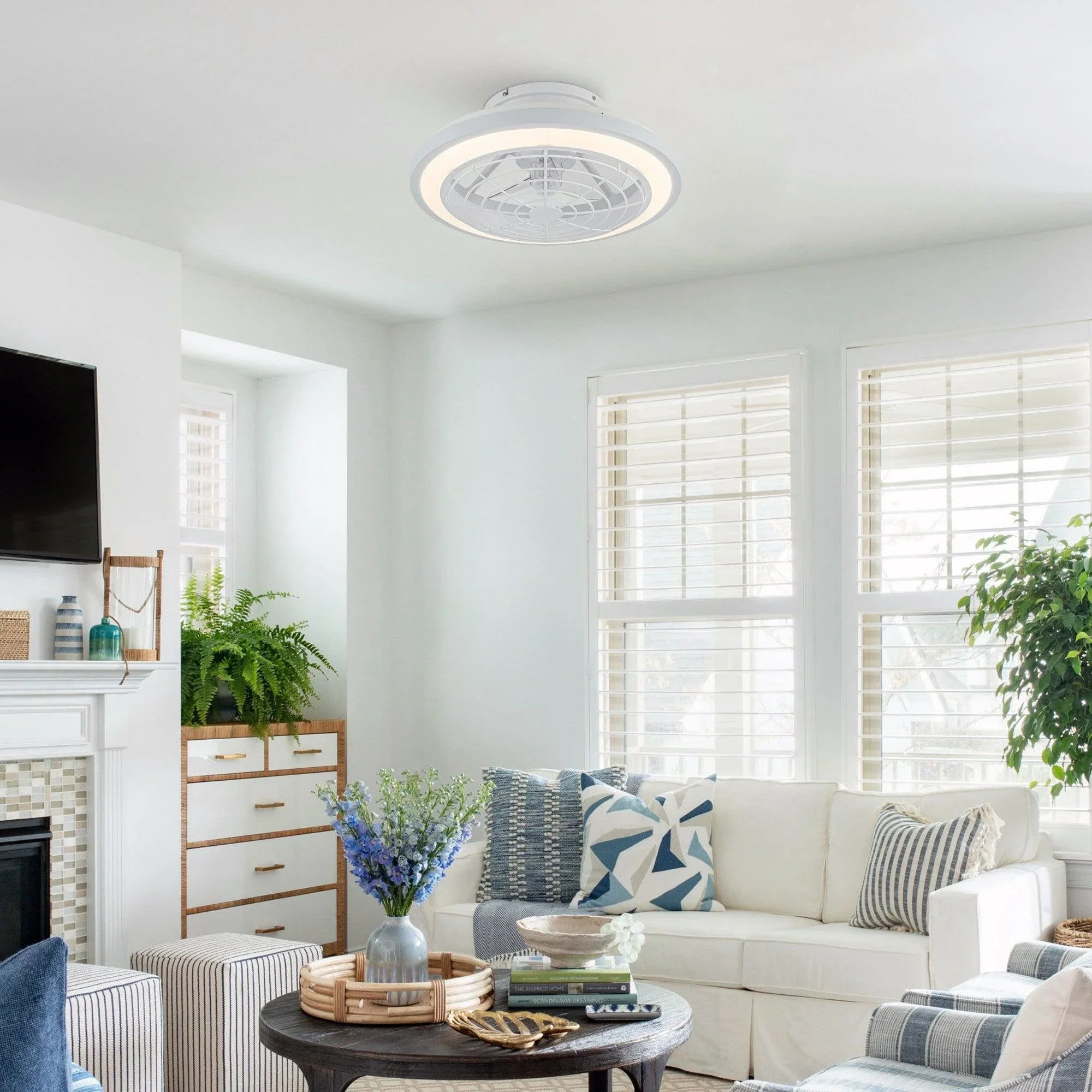 White flush-mount ceiling fan with integrated light installed on the ceiling