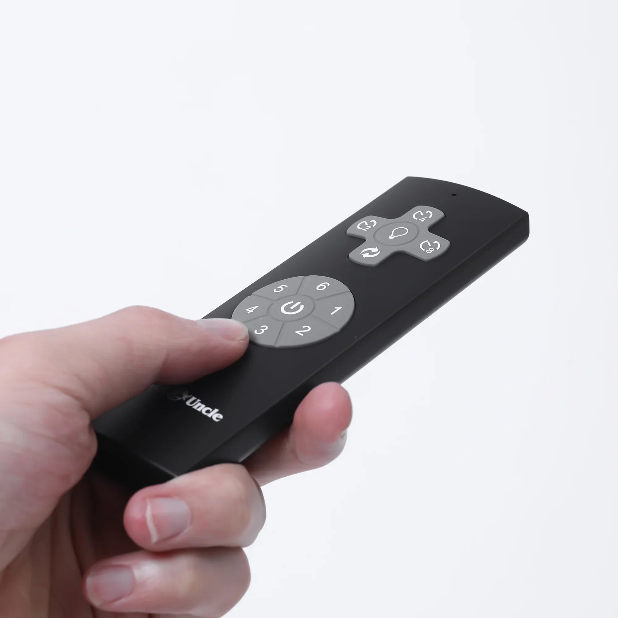 Parrot Uncle black ceiling fan remote control in hand