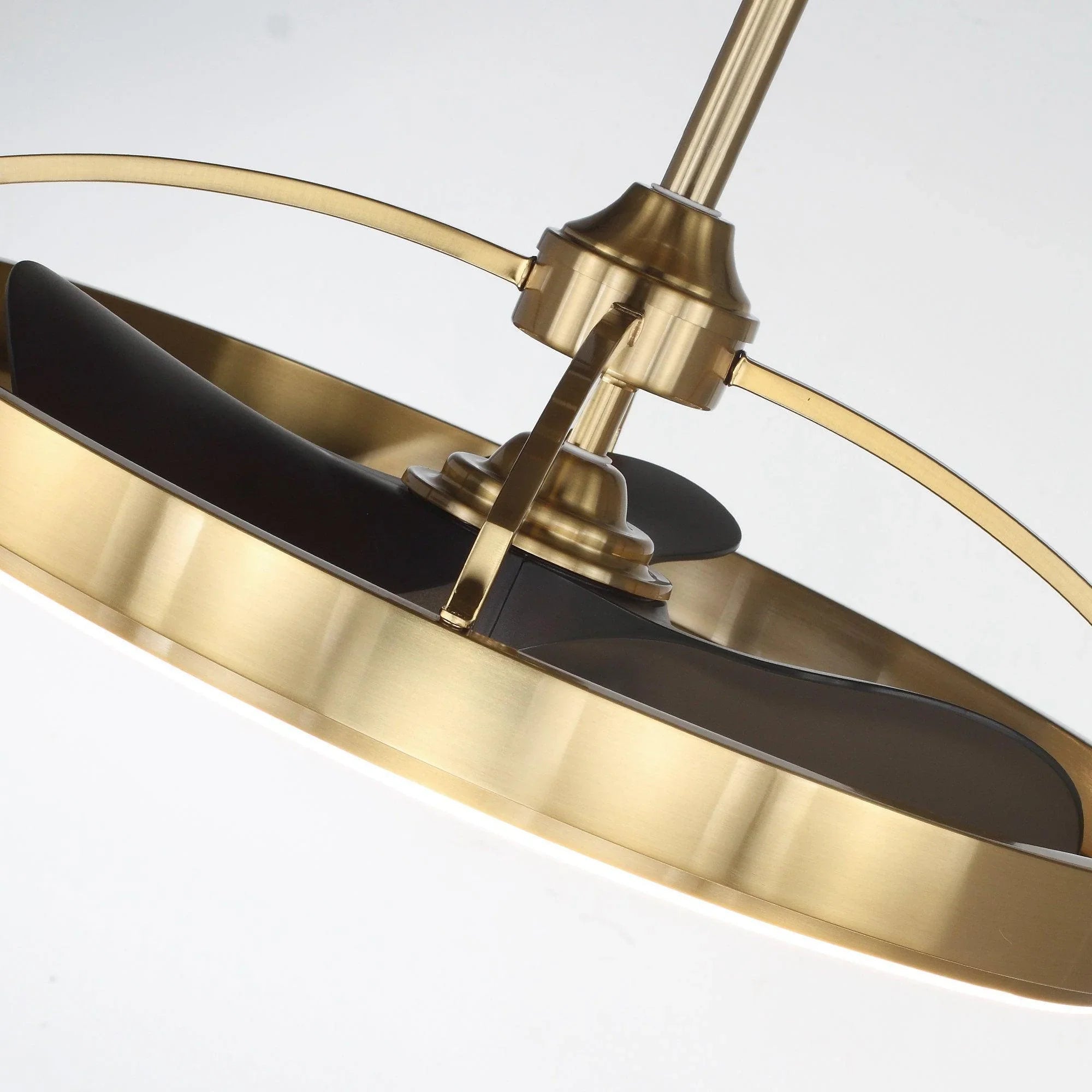 Golden ceiling fan downrod with sweeping ring light and black blades