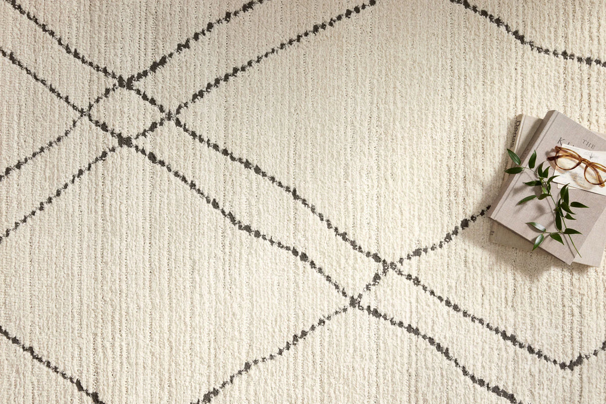 Ivory rug with charcoal crosshatch diamond lines and textured woven surface