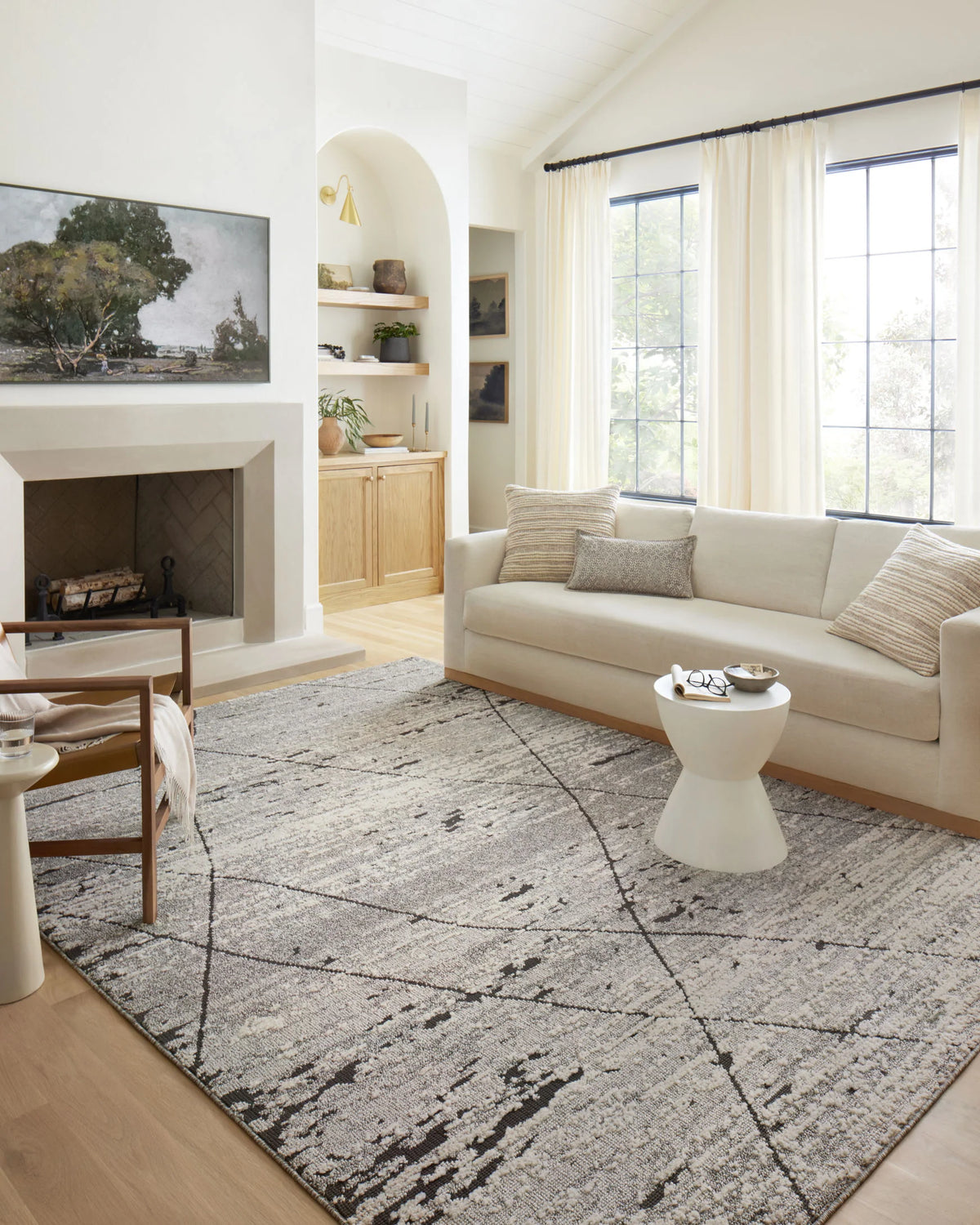 Grey and charcoal geometric area rug with diamond line pattern and distressed texture