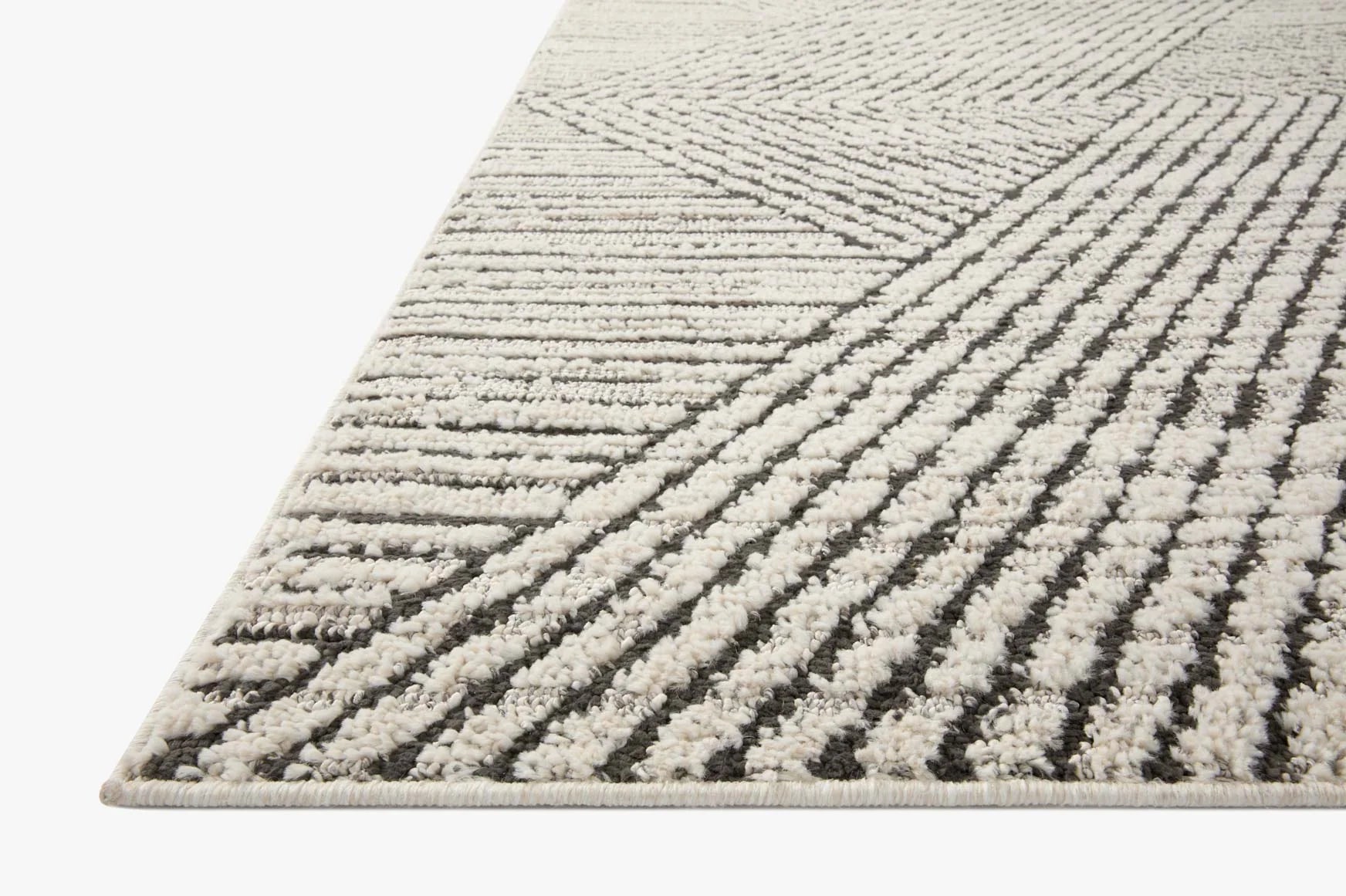 Ivory and charcoal accent rug with diagonal stripe pattern and textured low pile.