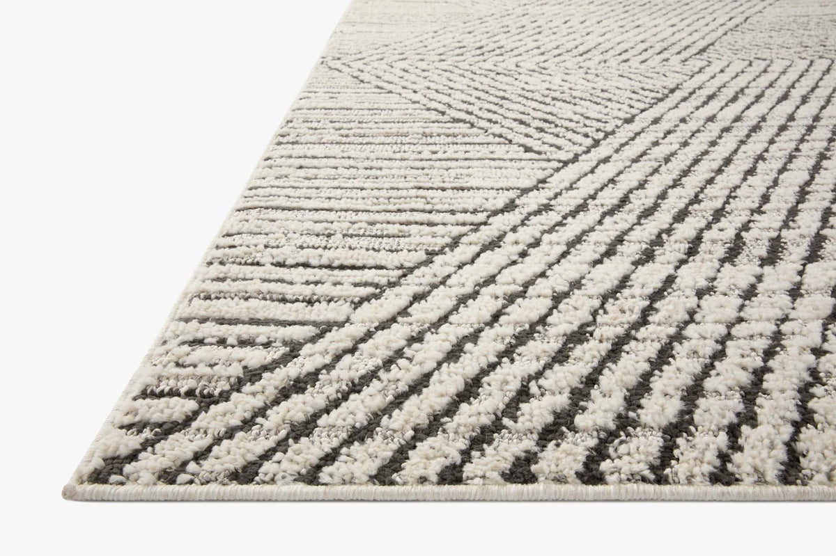 Ivory and charcoal transitional area rug with diagonal striped pattern detail.