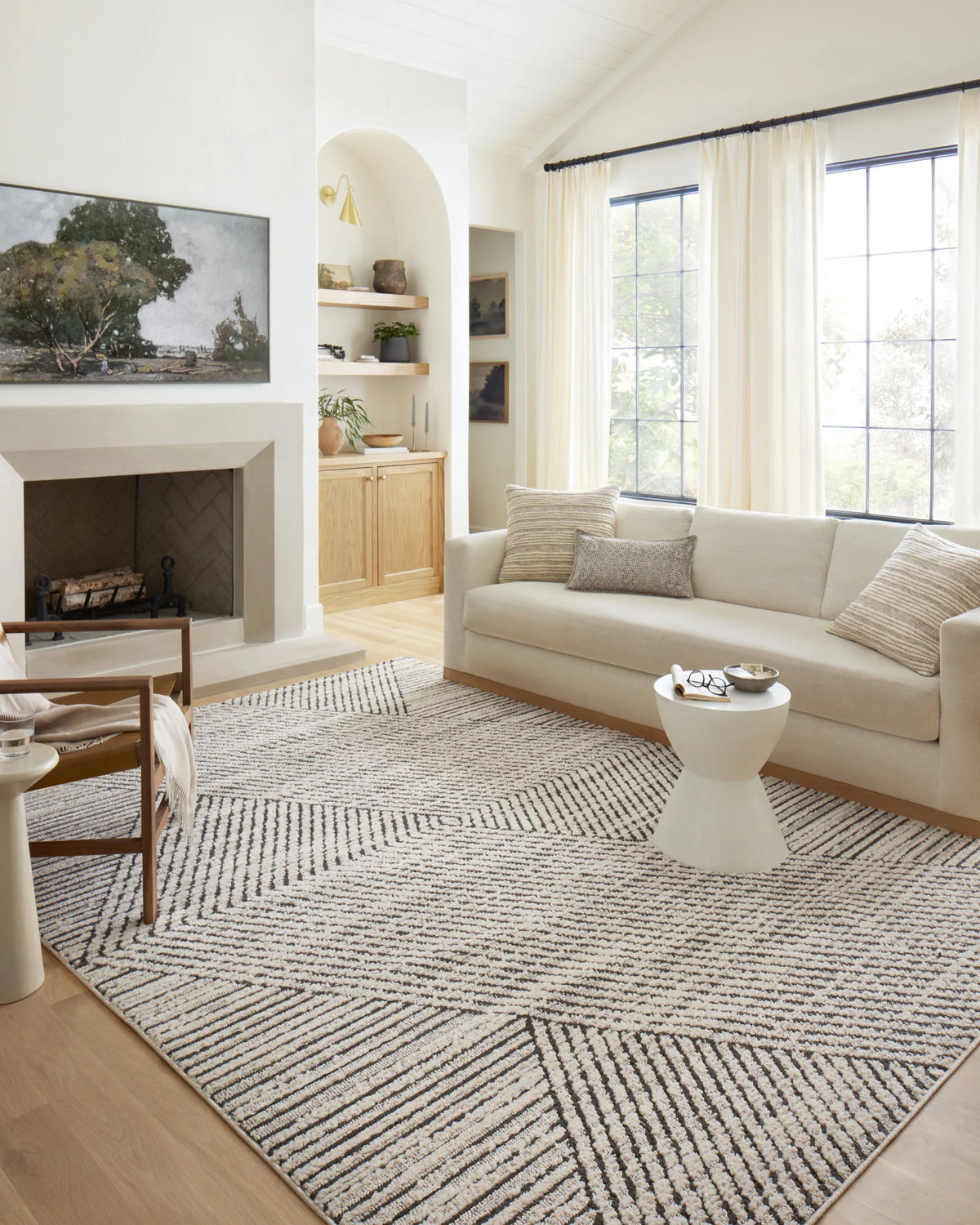 Ivory and charcoal geometric runner rug with striped design on hardwood floor