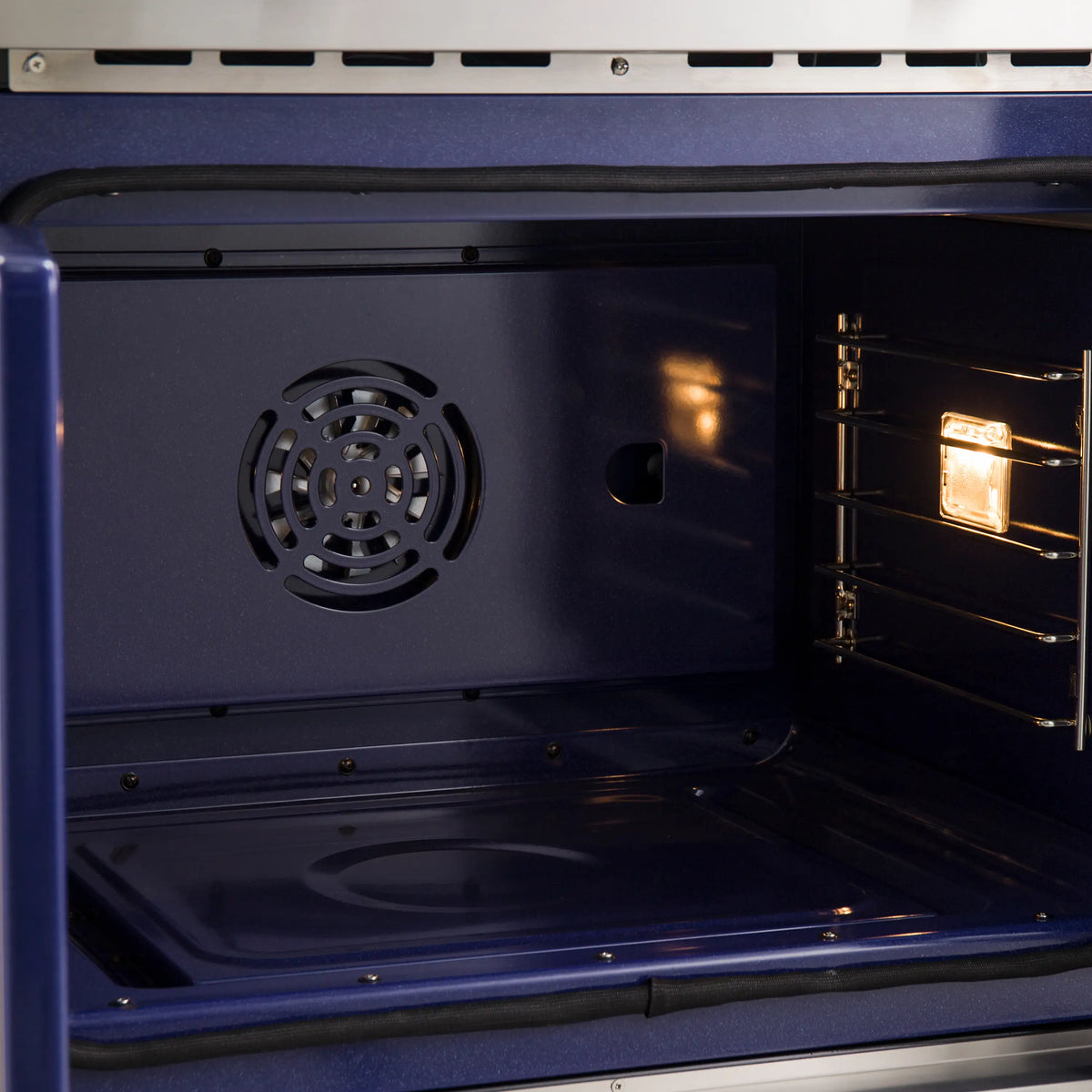 Electric oven cavity with fan vent and open French doors; interior light and racks