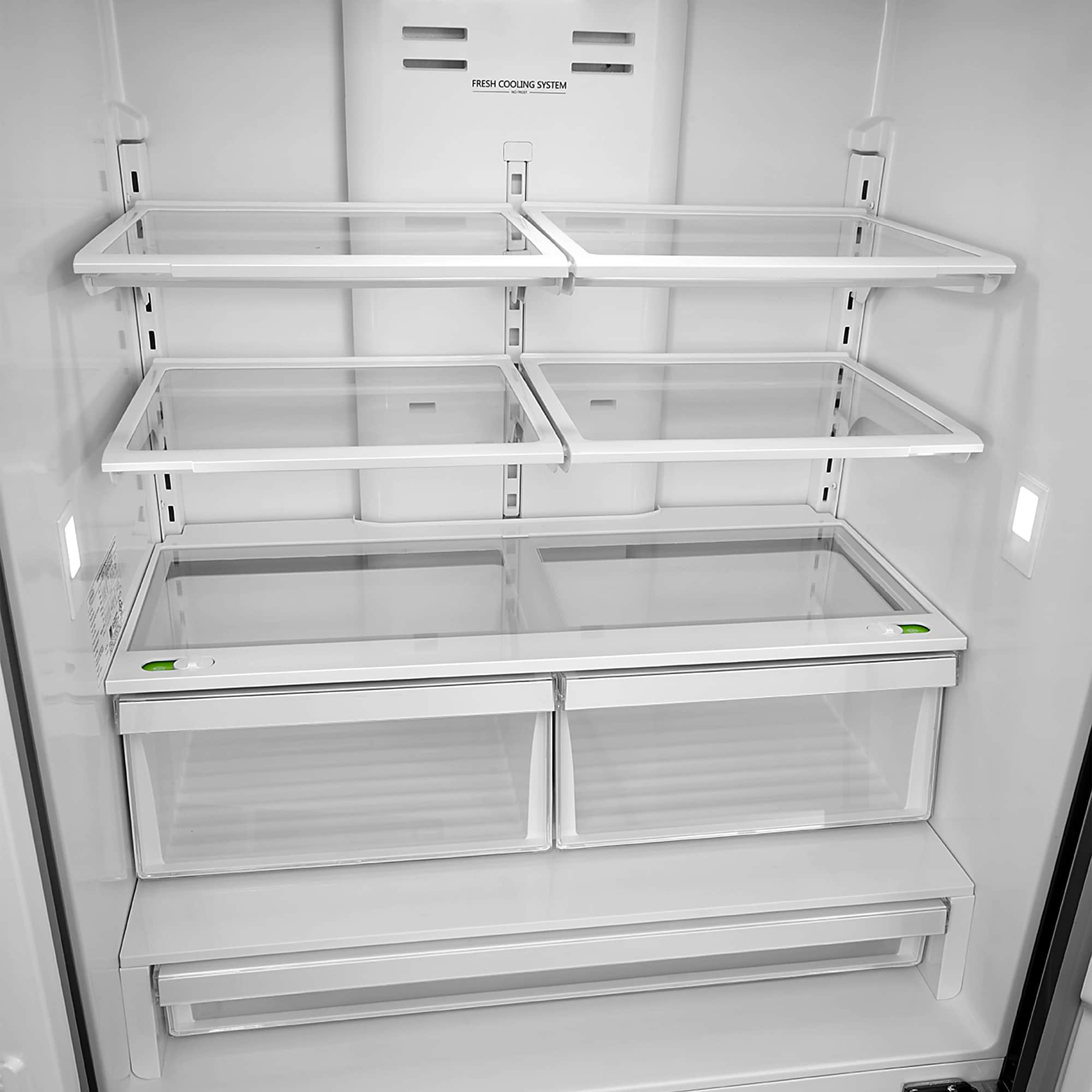 Open refrigerator interior with wire shelves and transparent crisper bins
