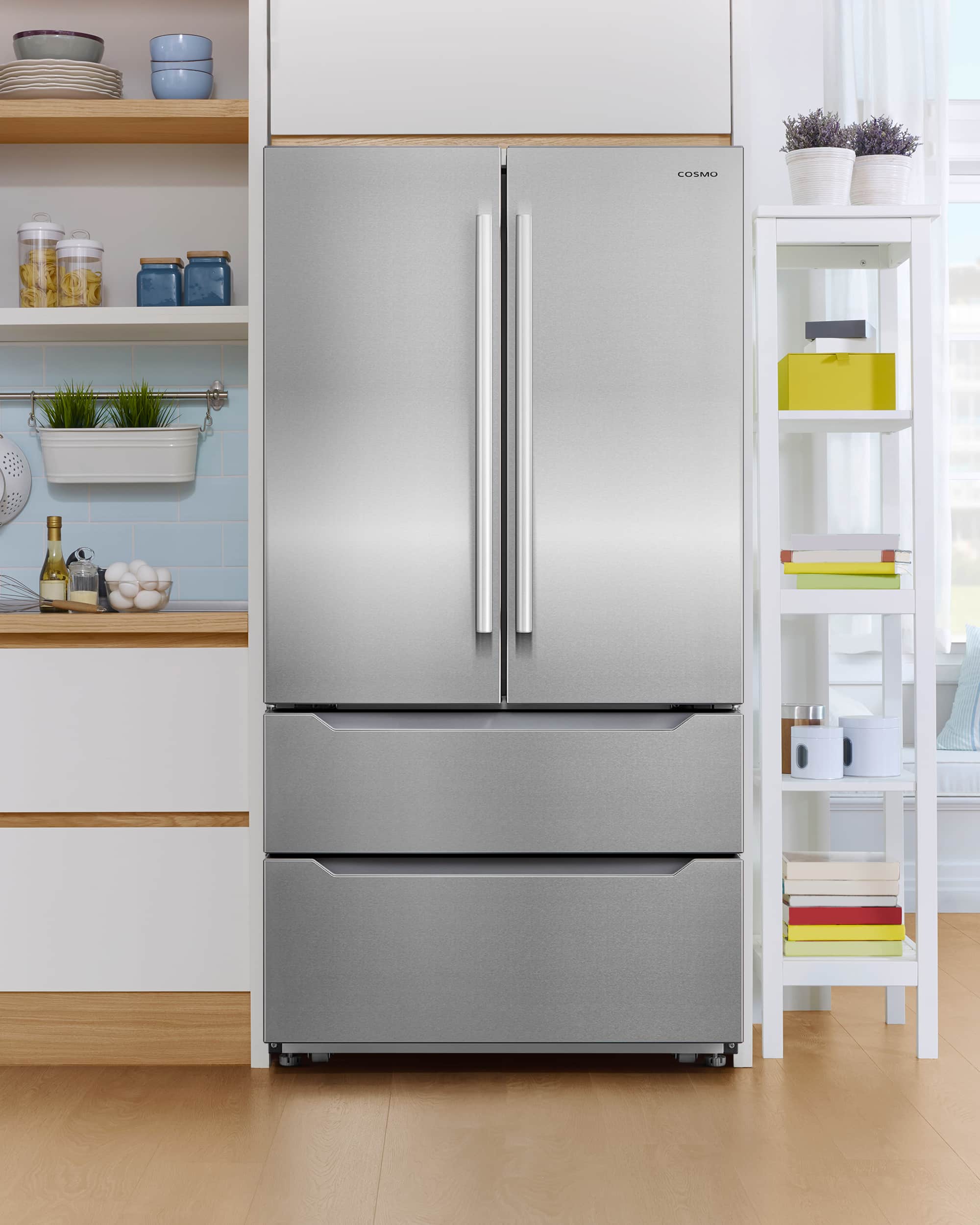 Stainless steel top-freezer refrigerator with two vertical bar handles, front view