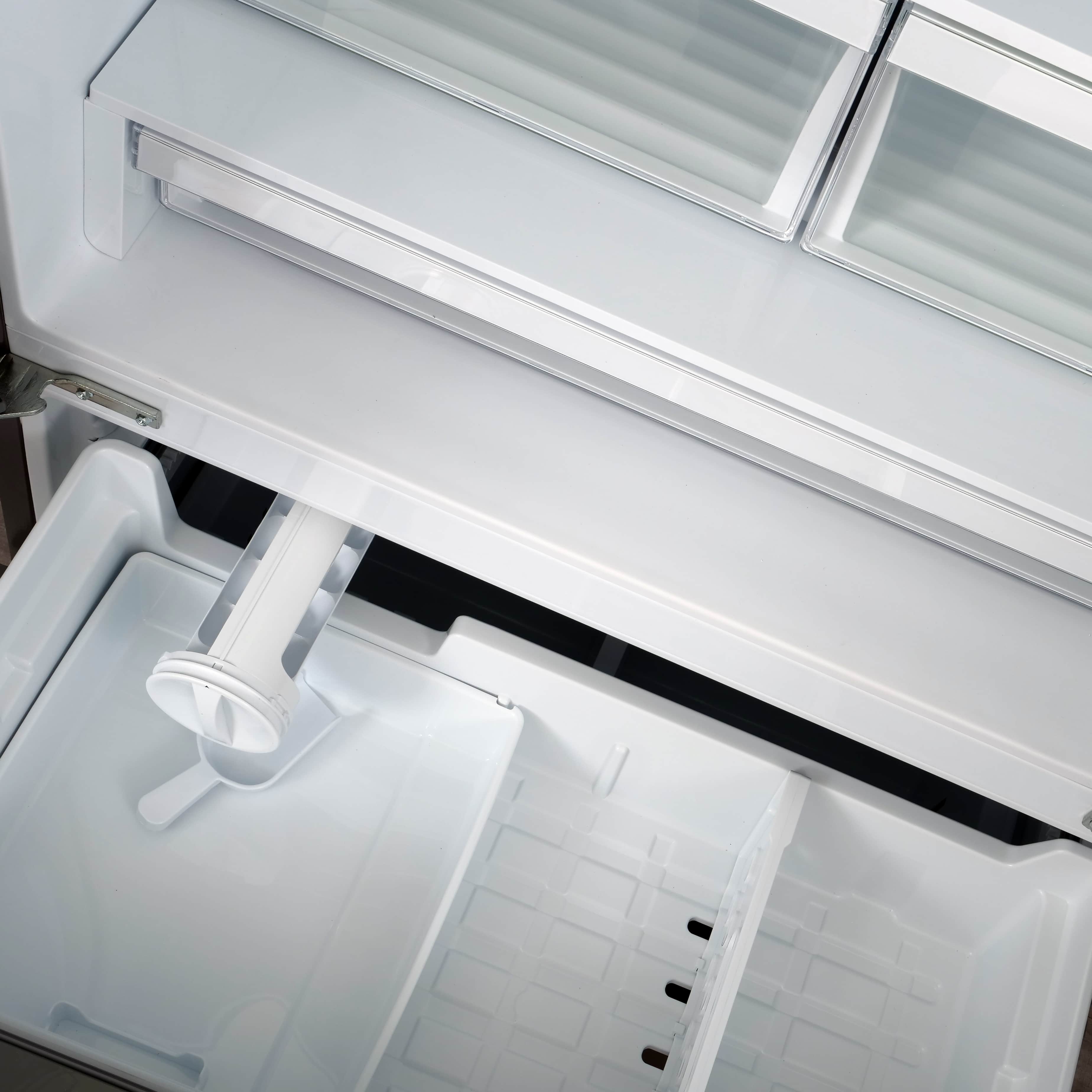 Refrigerator door bin area with clear shelves and inner drawers