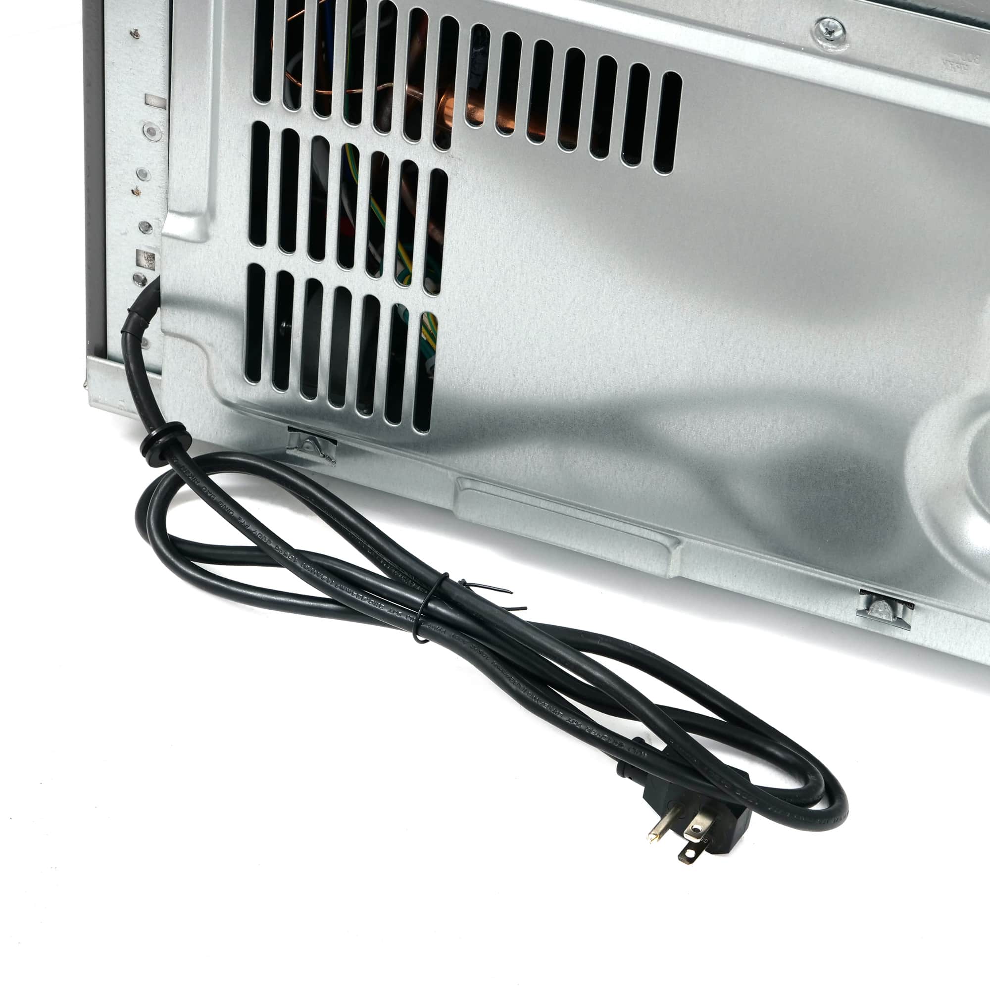 Refrigerator back panel with vent grille and power cord connection
