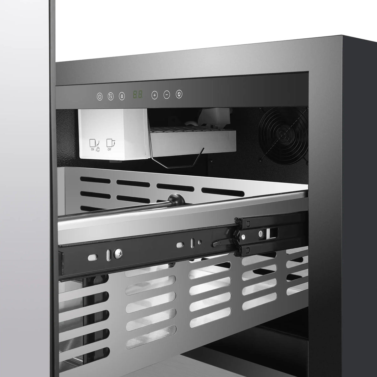 Drawer freezer interior with stainless tray, vent slots, and control panel on back