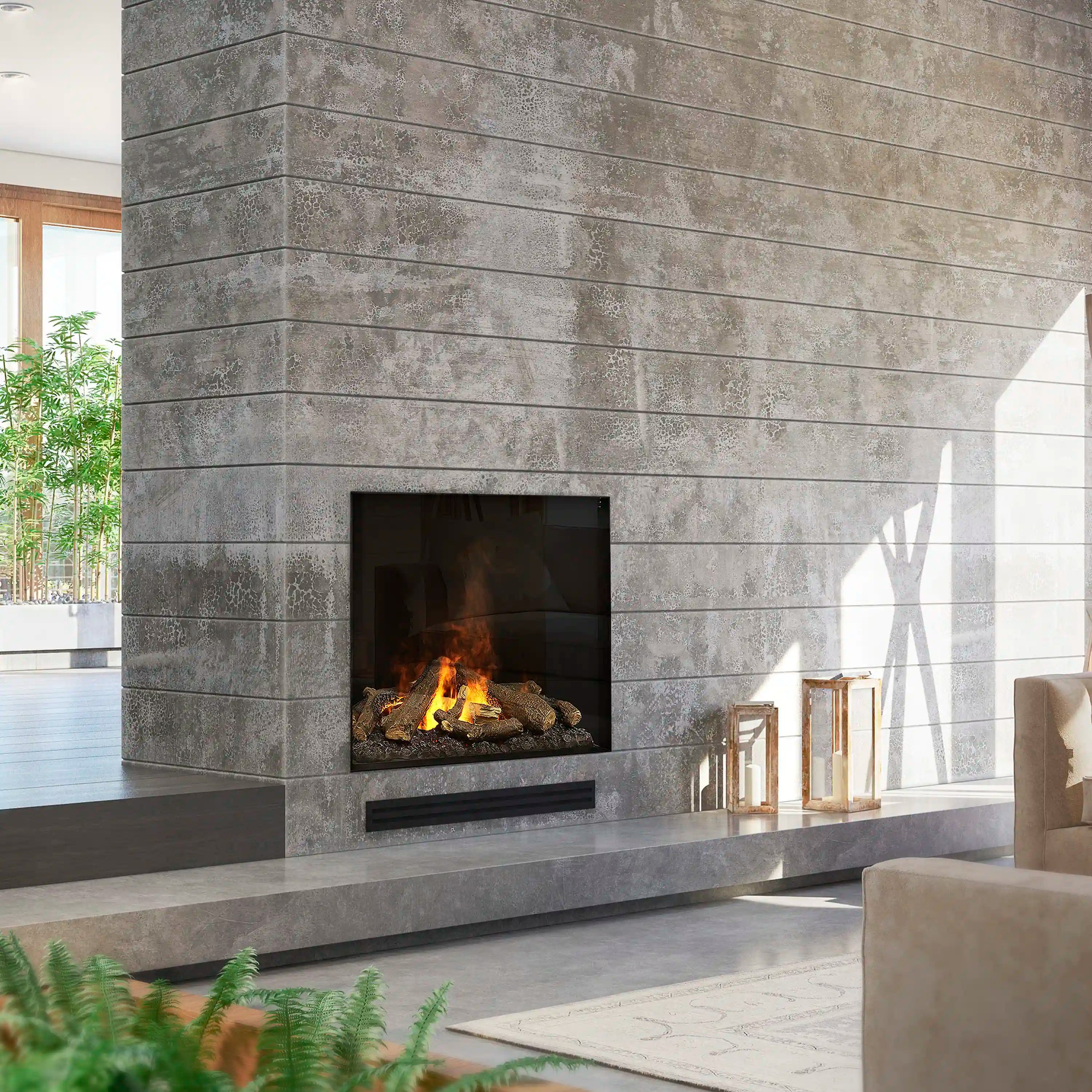 Recessed electric fireplace insert in gray stone wall with burning logs and embers