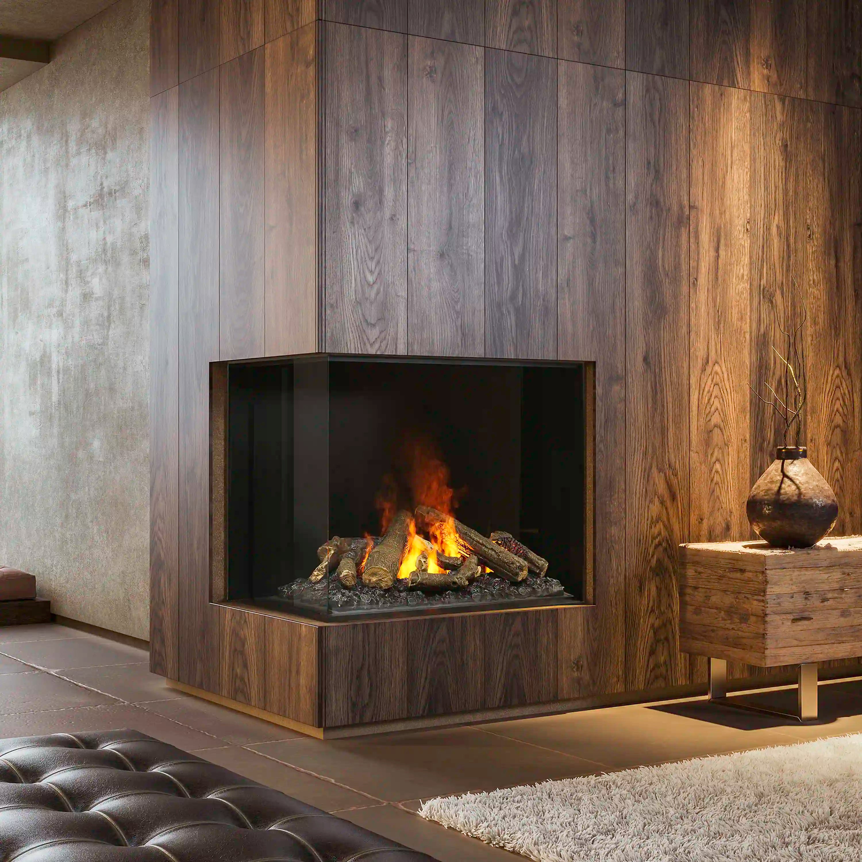 Electric firebox with burning log effect and black glass window in a wood surround
