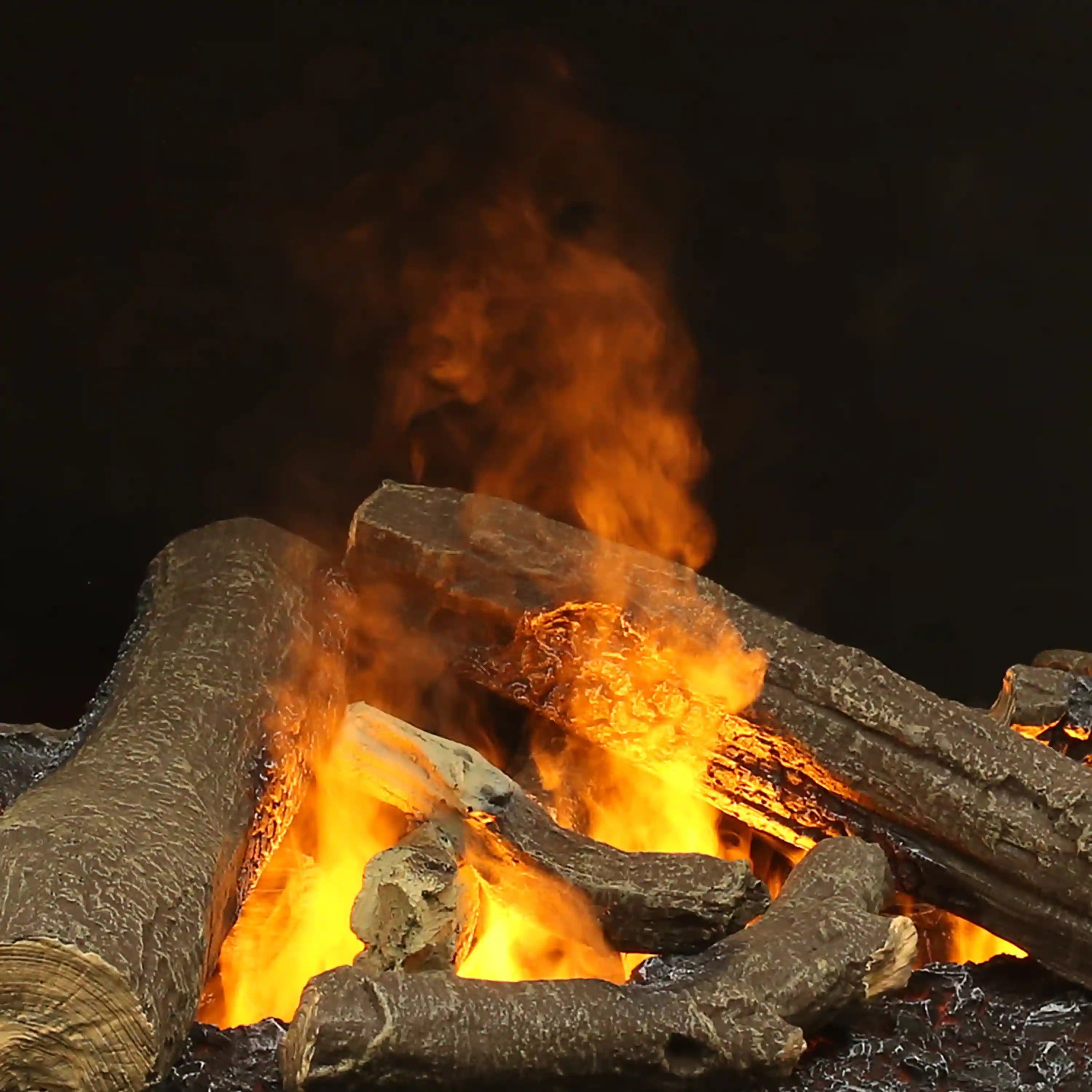Electric firebox flame effect with glowing logs and dark ember bed in a firebox