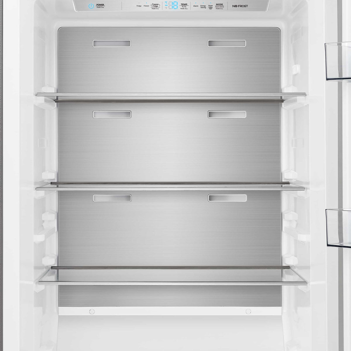 Refrigerator interior with three glass shelves and bright internal lighting