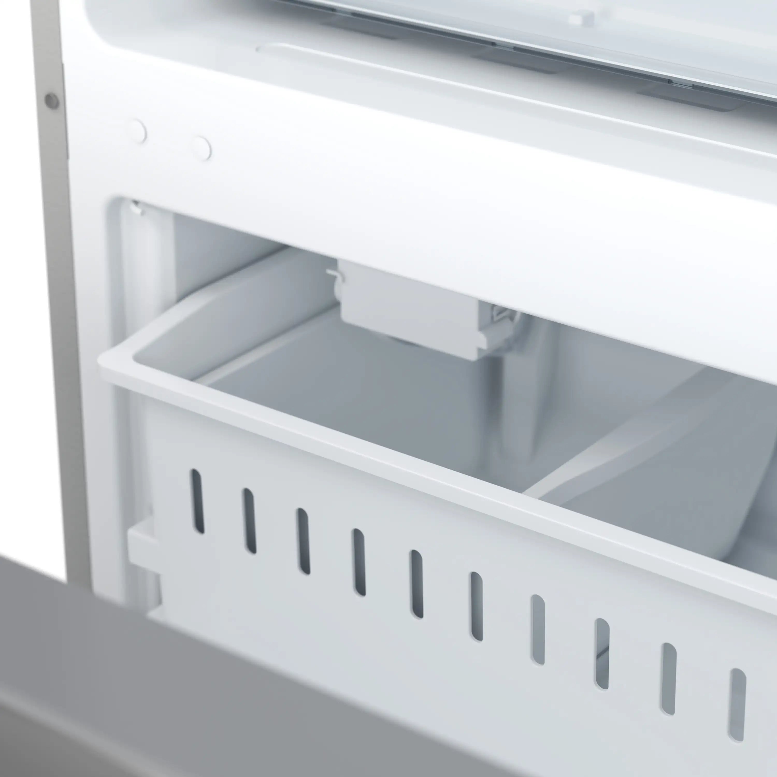 Bottom freezer drawer with white bins and vent slots inside refrigerator.