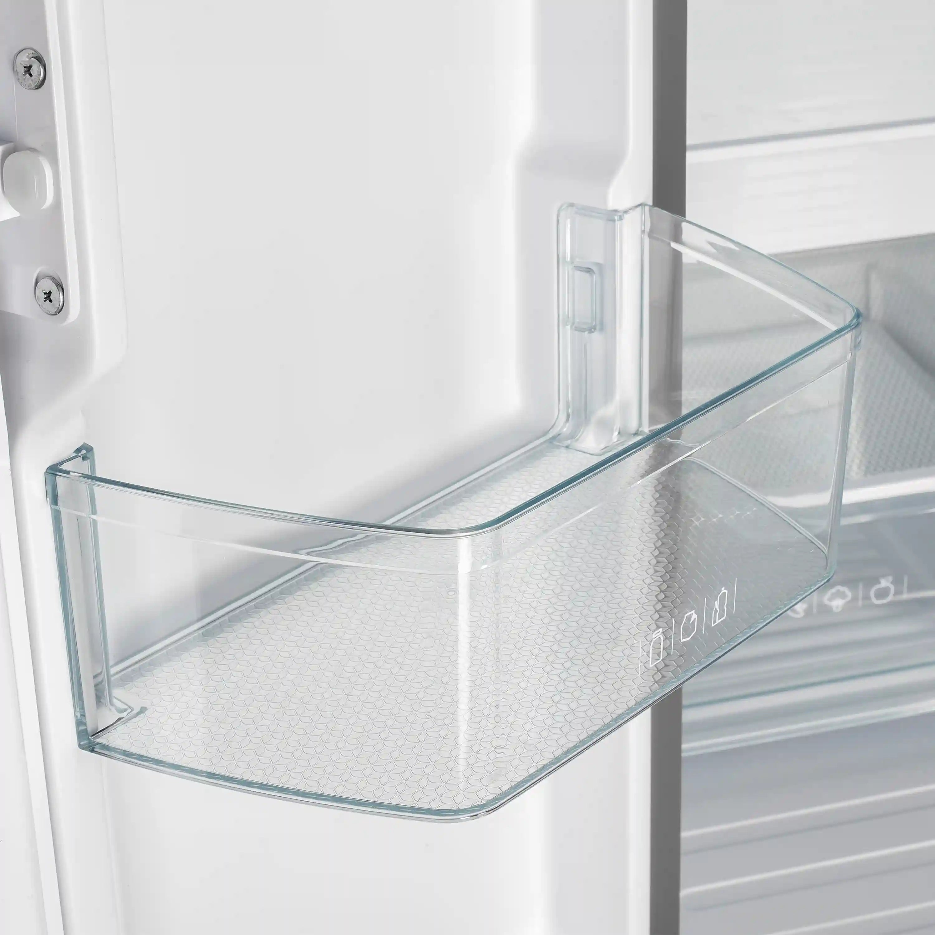 Glass shelf inside refrigerator door with clear door bin and frosted interior backing